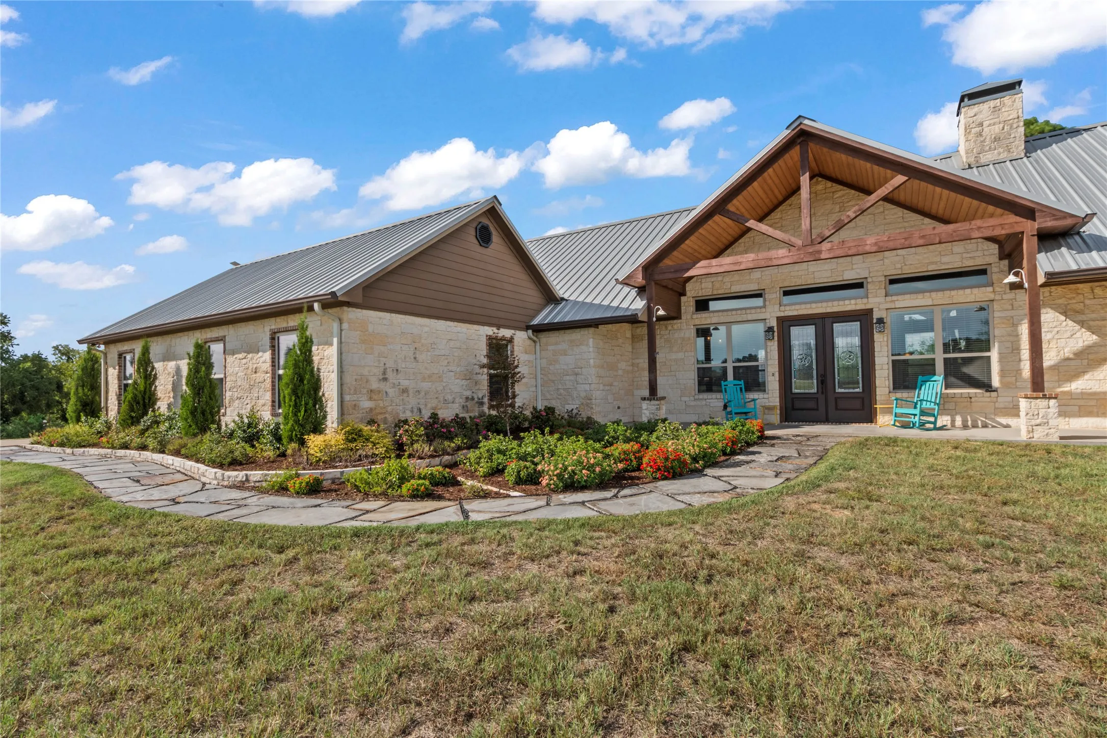 Front porch with landscaped yard