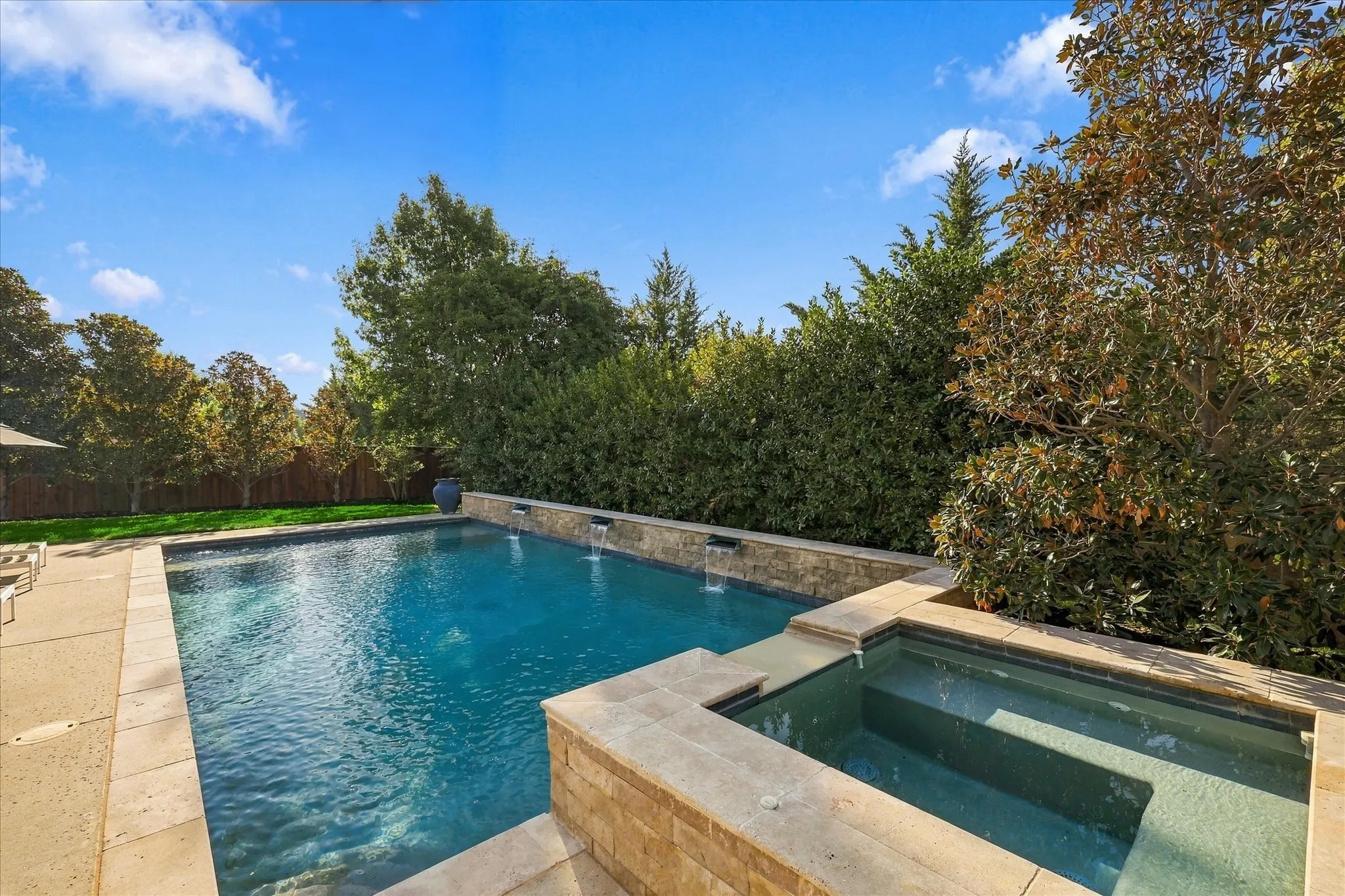 And the lush landscaping around bringing privacy that you will treasure. And a large spa too.