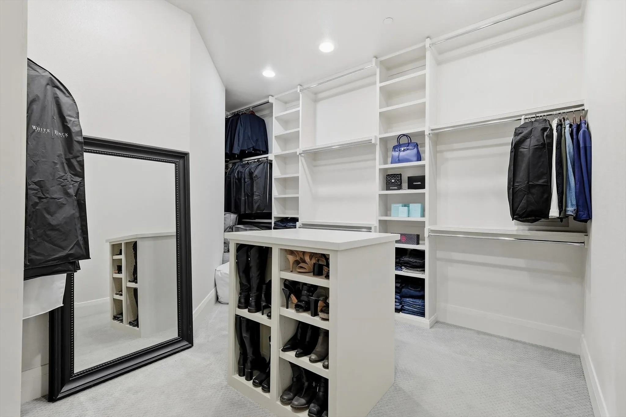 And a peek at one of the closets with built in and an abundance of areas for hanging
