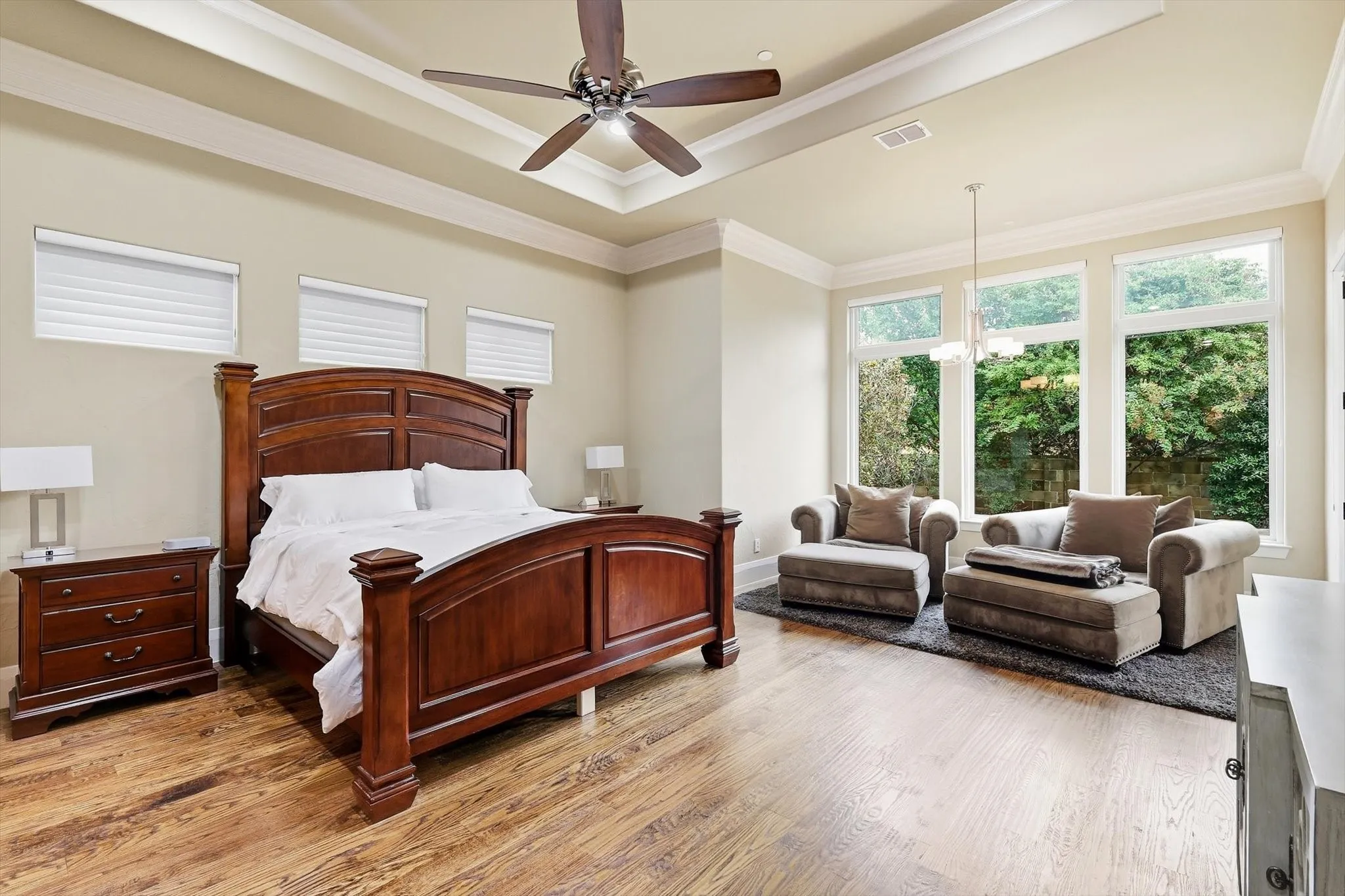 Grand primary with sitting area infront of the picture windows giving a full view of the tranquil backyard paradise