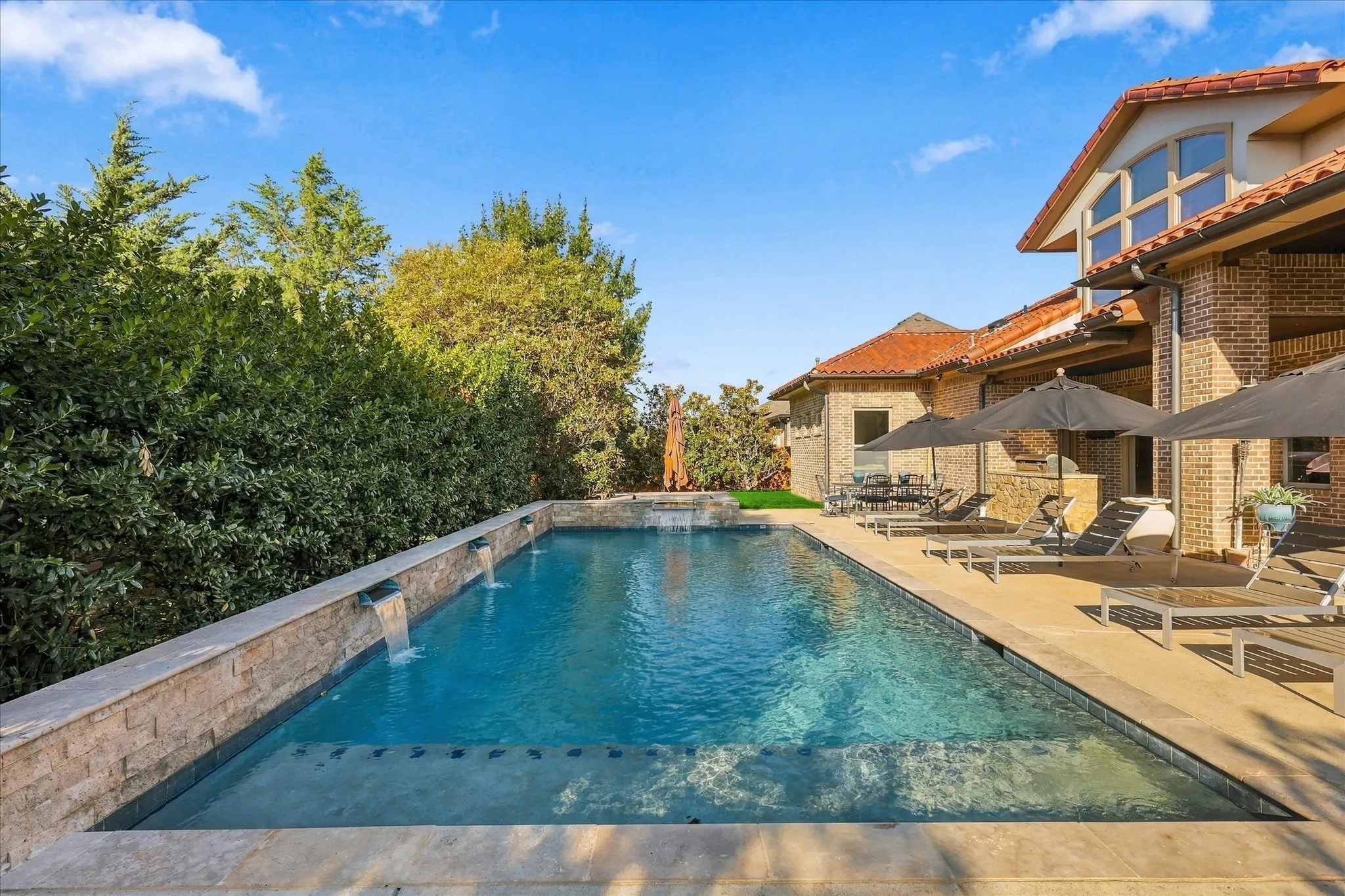 Sparkling Pool. 4 water features & spa in private backyard. Attractive landscaping.
