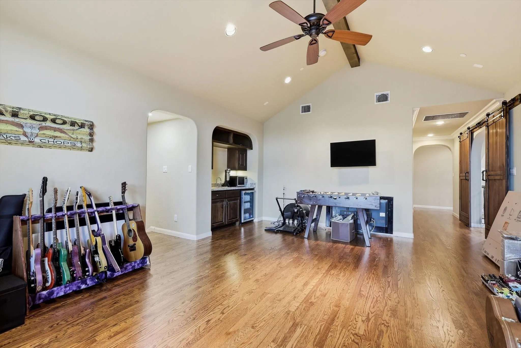 Game room up.Handscraped wood floors. Wet bar and beverage fridge