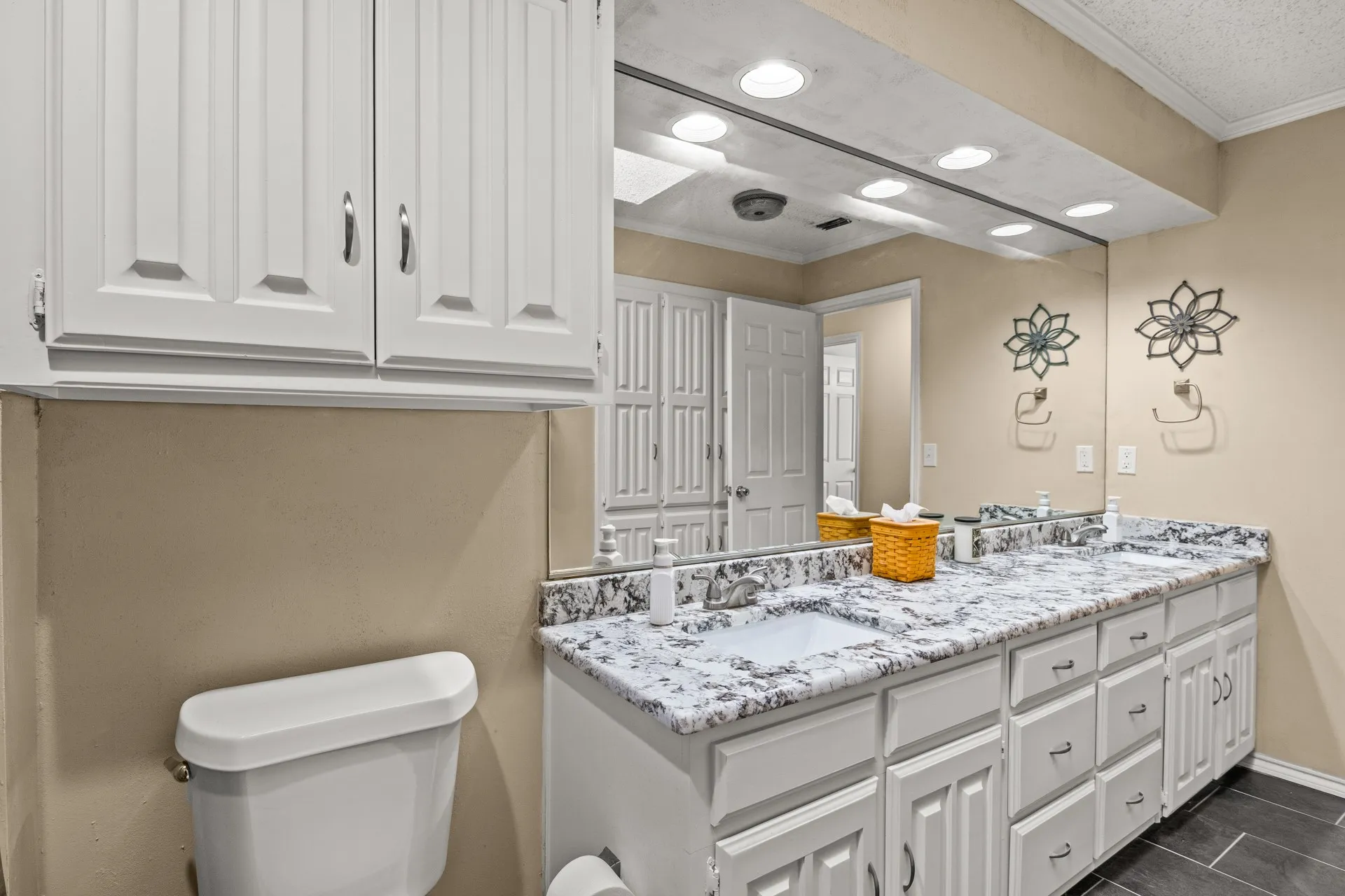 Full bathroom with double vanity, crown molding, recessed lighting, and tile patterned floors