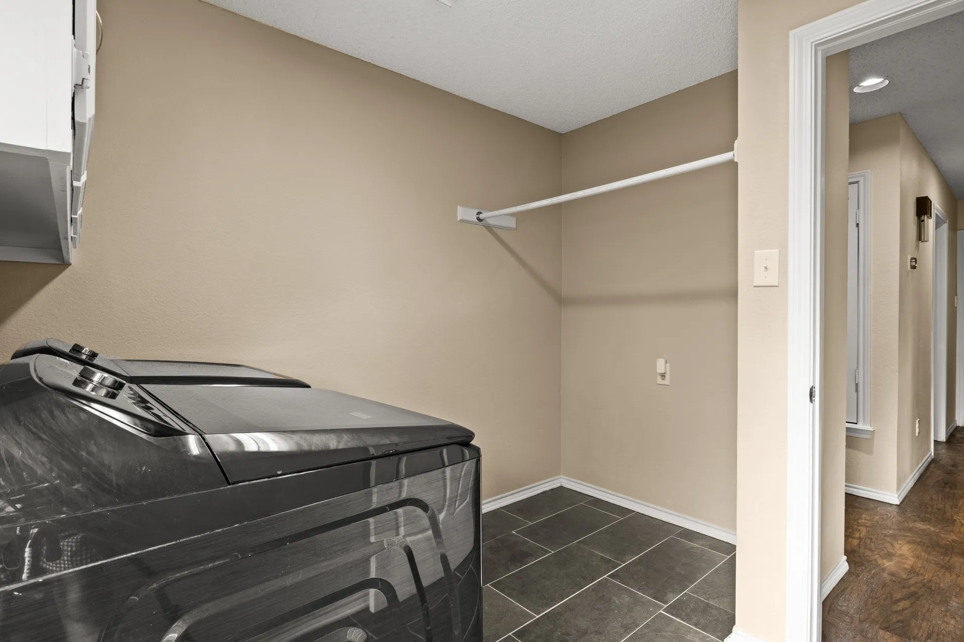 Washroom with baseboards and washer and dryer