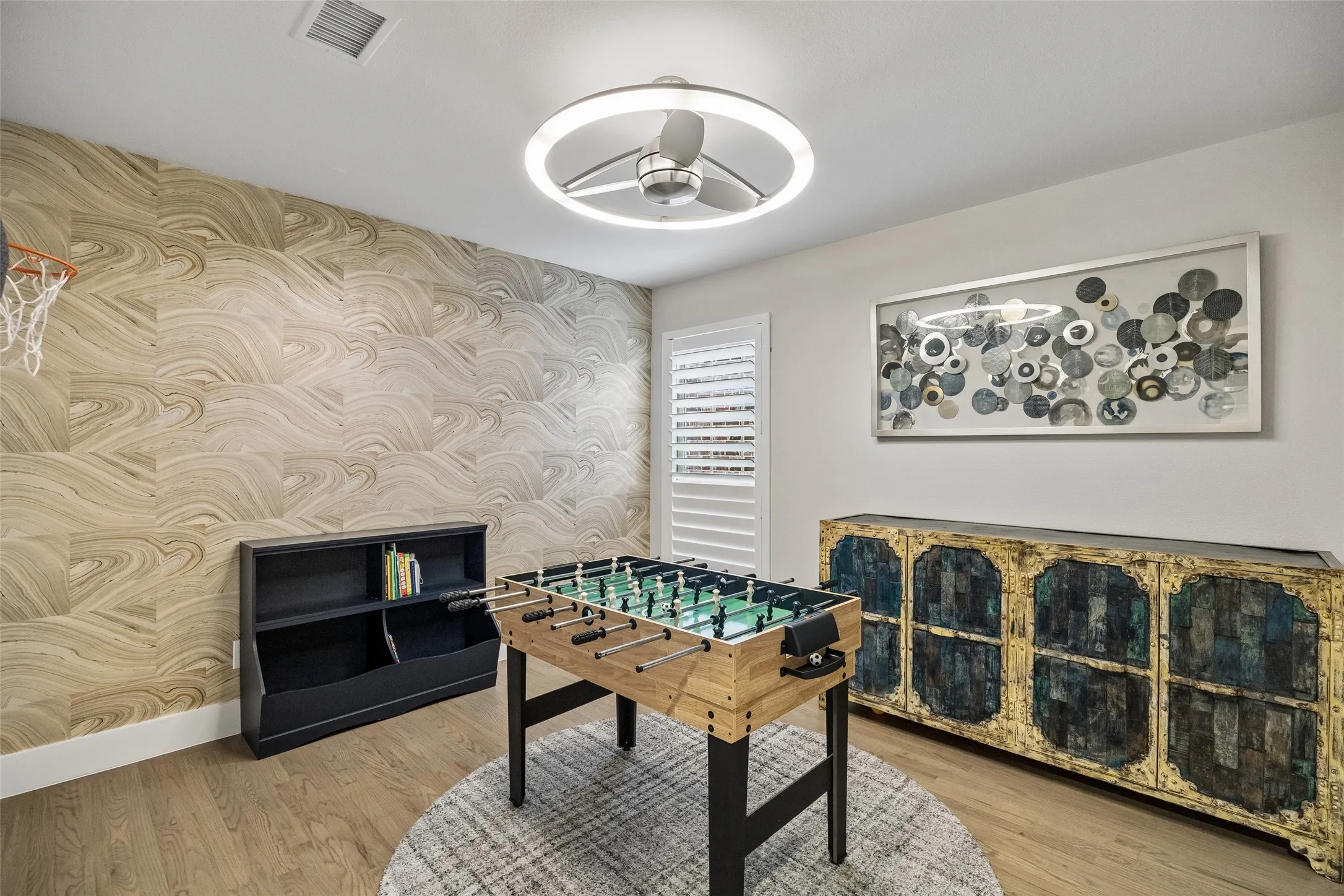 Bedroom being used as a game room.