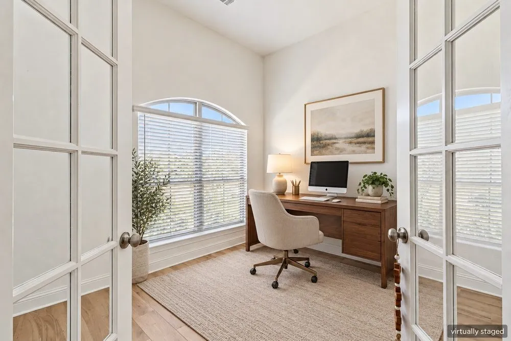 Virtually staged dedicated office off the entryway.
