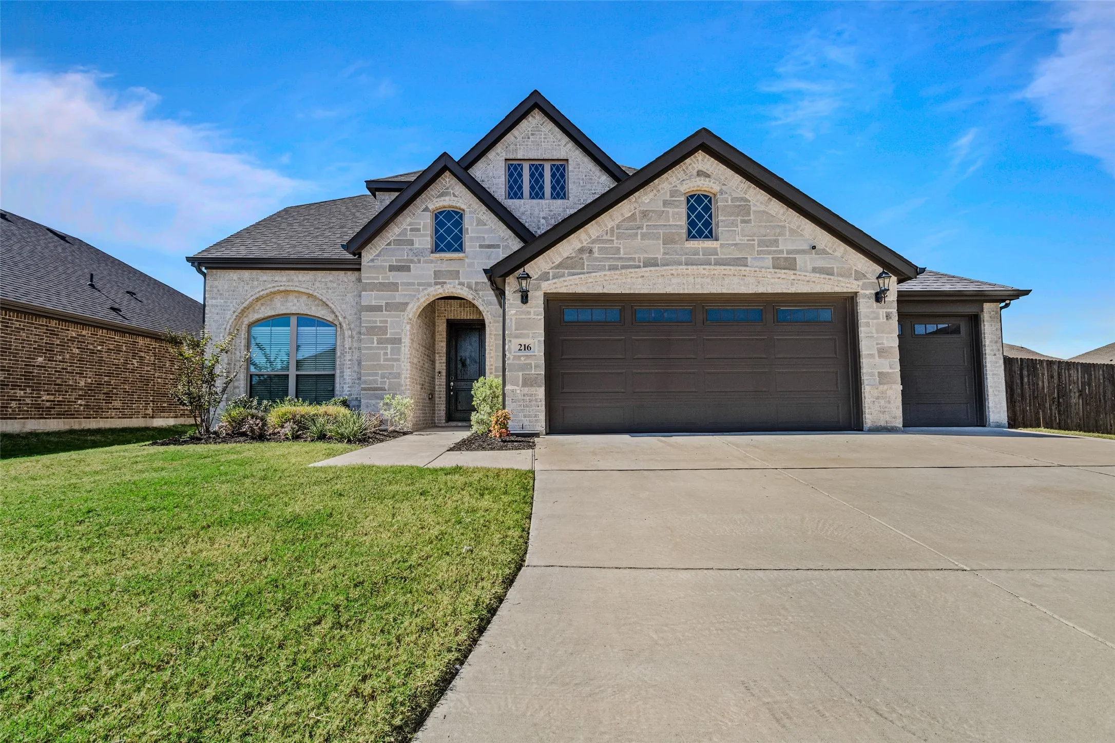 Three car garage and large wide driveway!