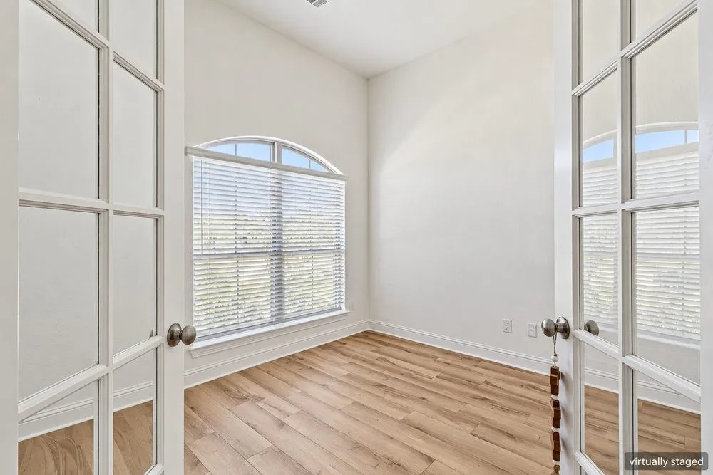 Dedicated office off the entry with French double doors