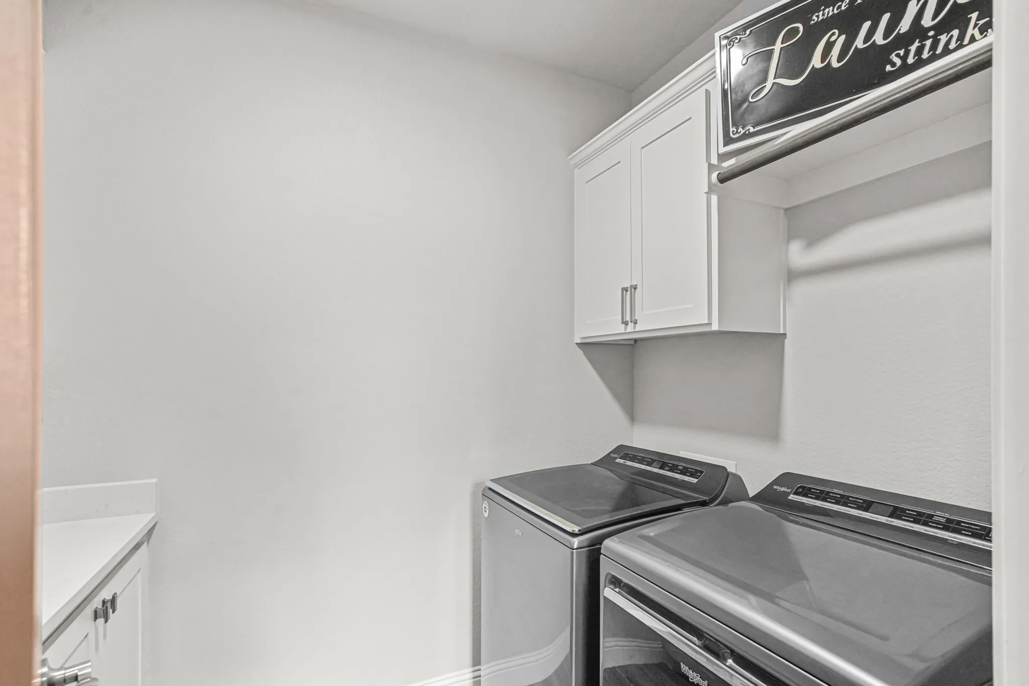 White upper cabinetry with brushed nickel hardware