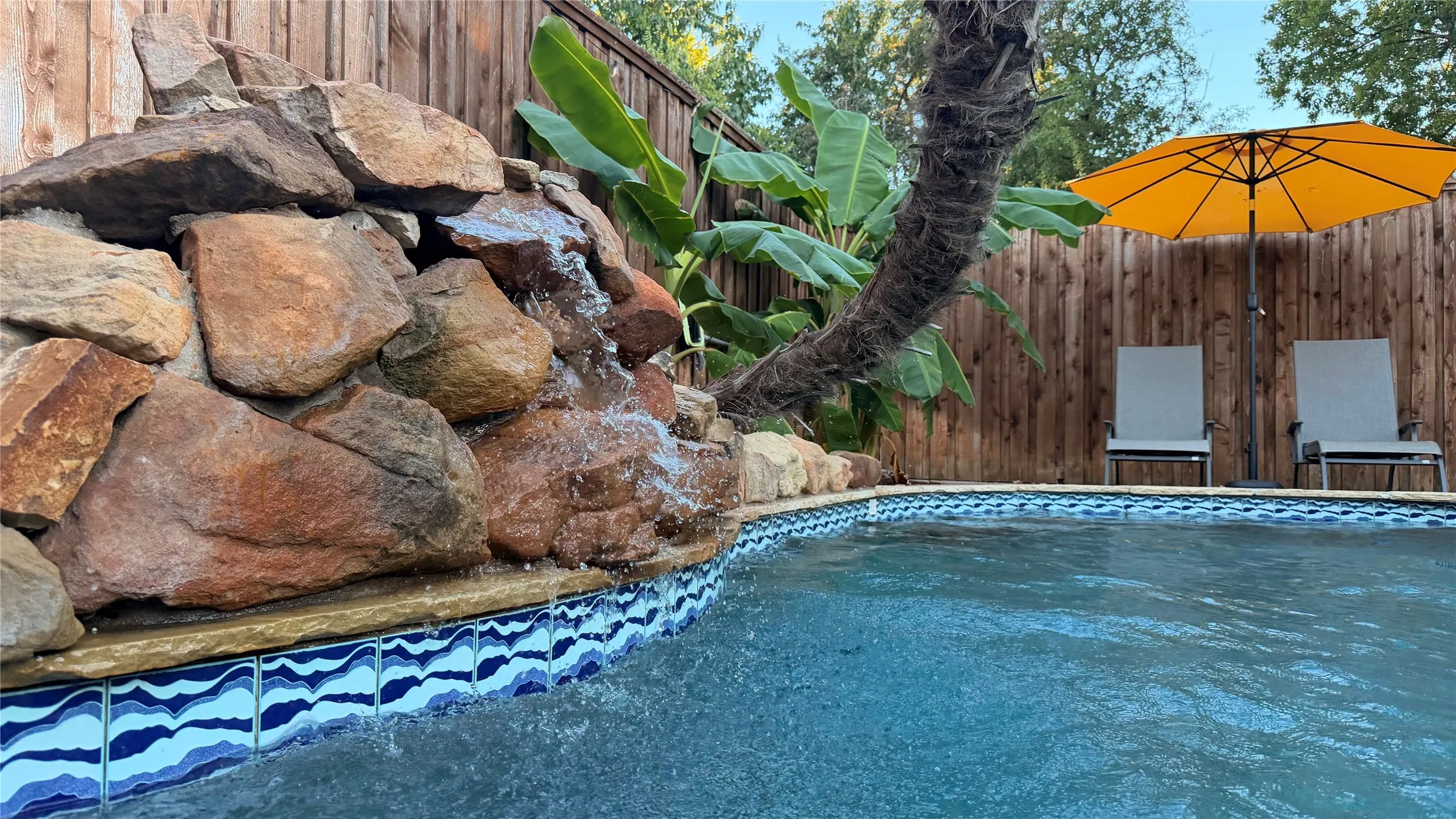 Heated pool with spa/waterfall is spring/summer-ready.