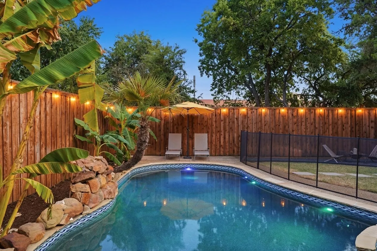 View of pool with waterfall.
