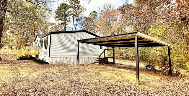 Mobile Home For Sale in Harrison County , 409 Cross Creek Road, Longview, Texas 75602, 3 Bedroom, 2 Bathroom, Garage spaces, 1,456 Sqft, built in 2001, mls#21393871, Real Estate Agent in Longview, Homes For Sale in Harrison county, Homes For Sale in Longview, Realtor in Longview Texas, Real Estate Brokerage Independent Realty Texas, Luminita Cordes Realtor