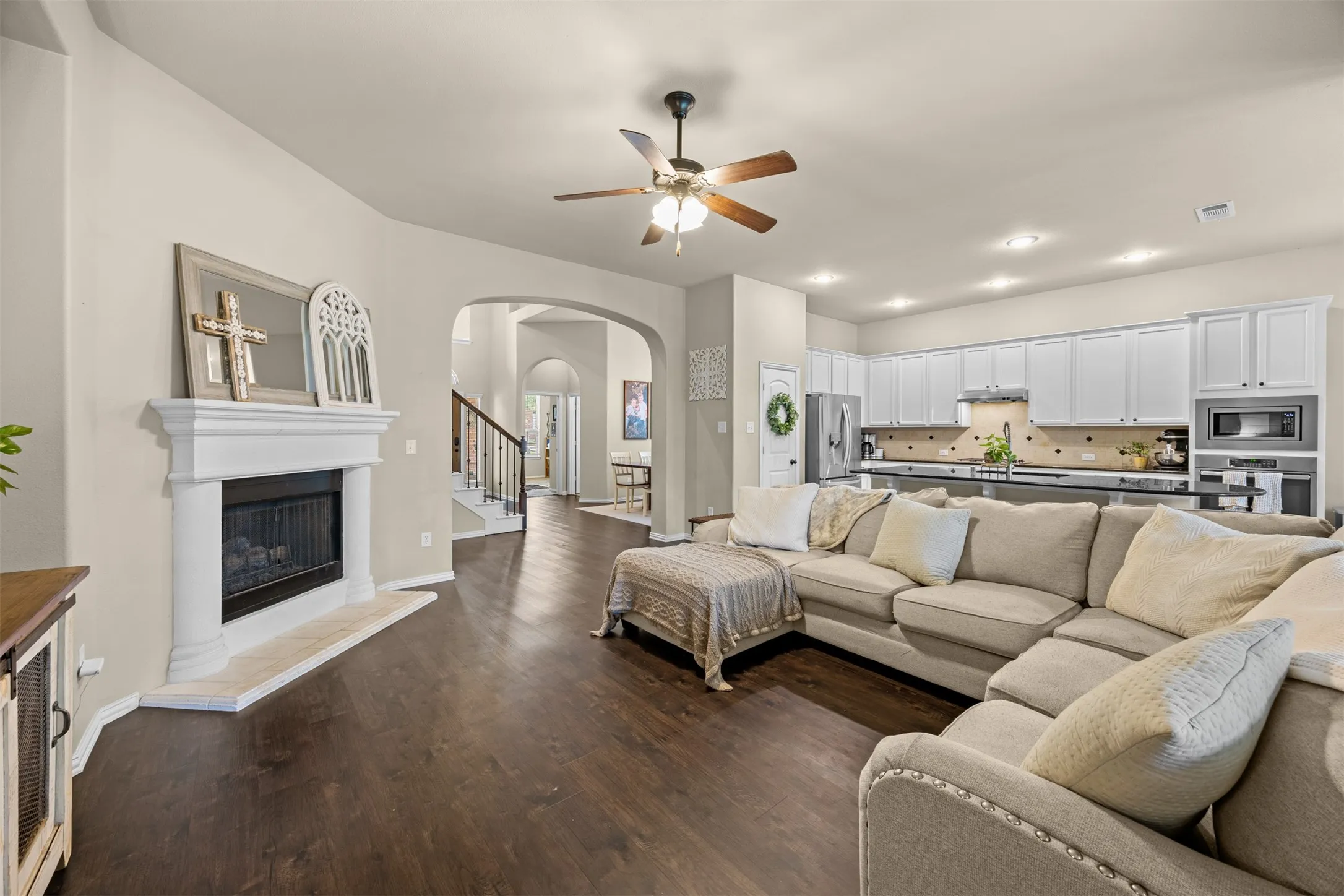 Open family room with fireplace, natural light and an easy connection to the kitchen and breakfast area.