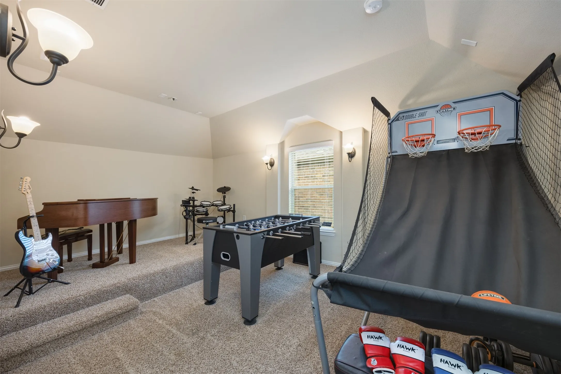 Dedicated Upstairs media or bonus room currently used as a sports/game room