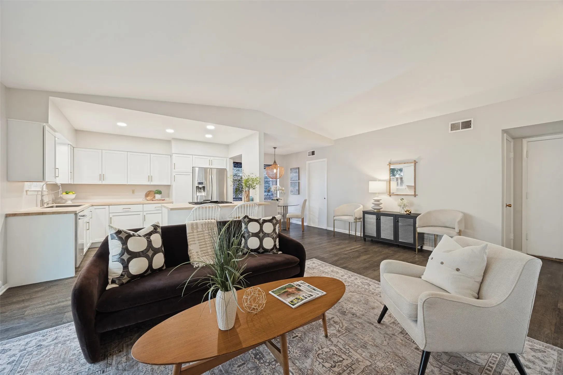 Kitchen featuring white cabinetry and stainless steel appliances
