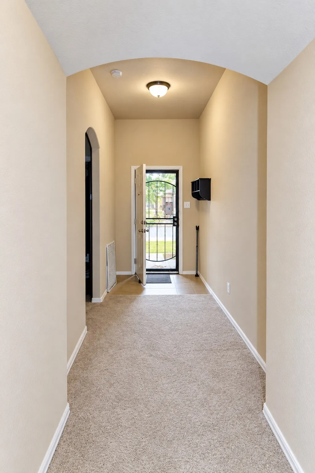 Beautiful arched foyer leading into the home.
