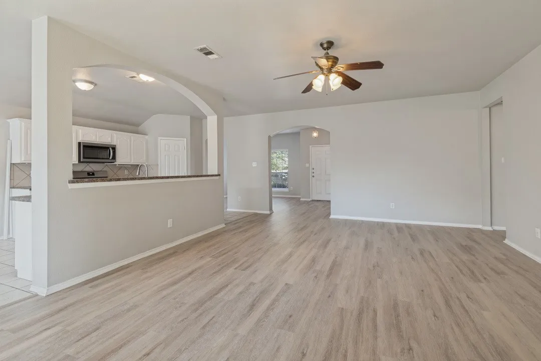 Neutral-toned walls complement wood-finish flooring