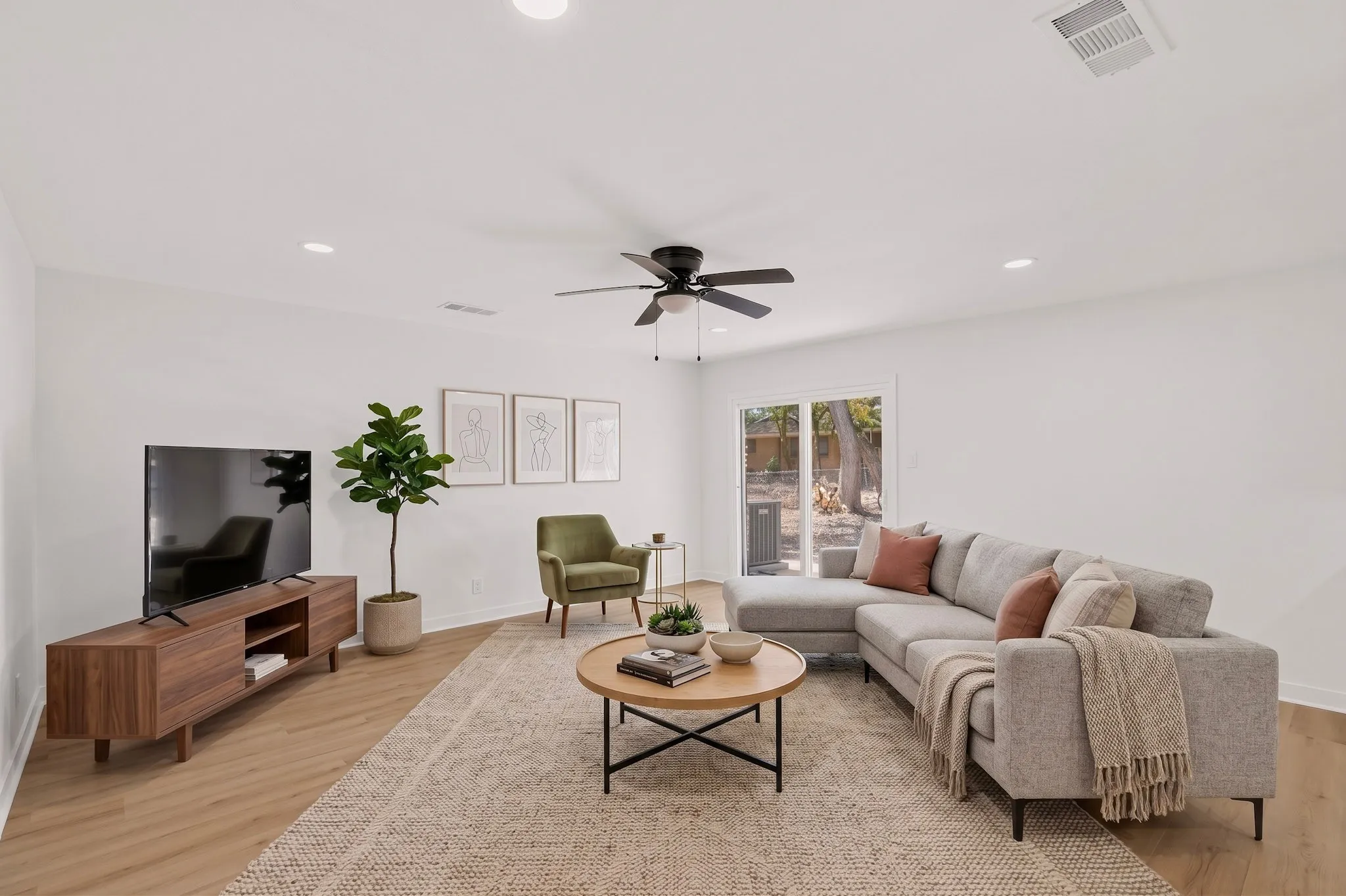 Recessed lighting, wood-finish flooring, and a ceiling fan with light fixture