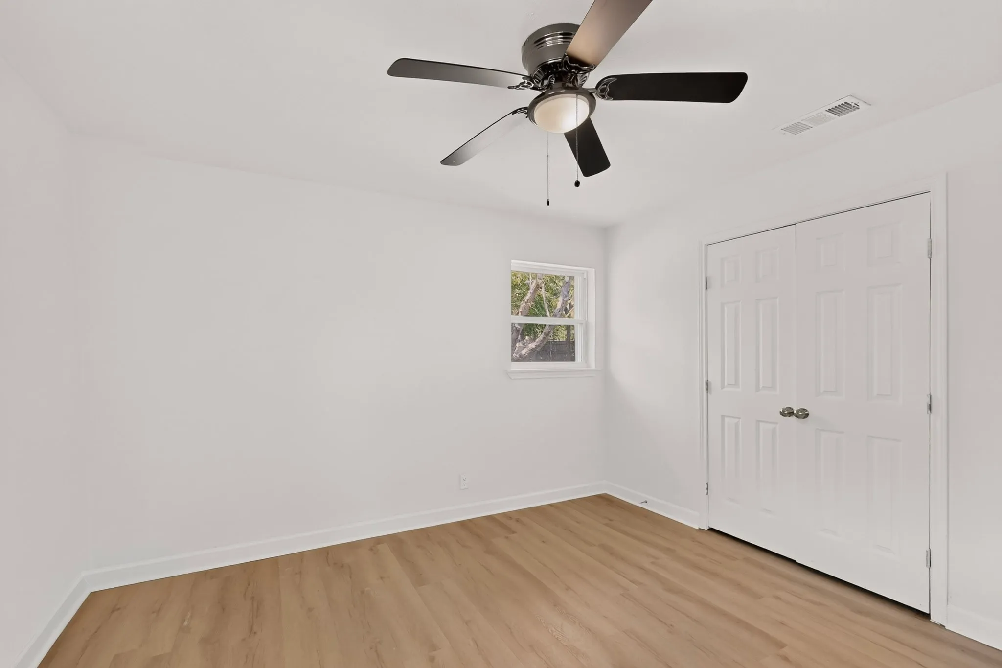 Recessed lighting, ceiling fan with integrated light, wood-finish flooring, white trim, and a white six-panel bi-fold door