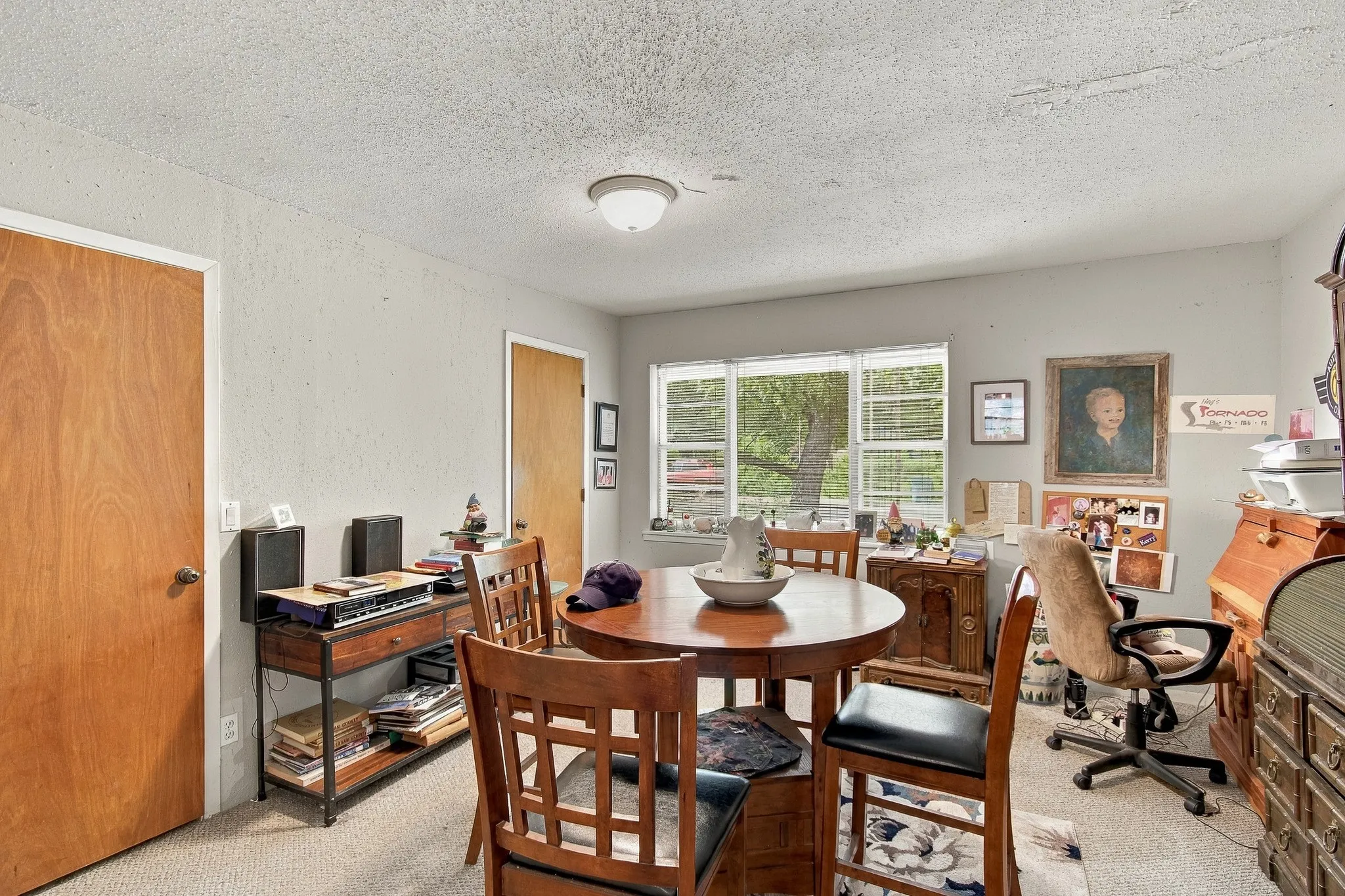 Light gray wall paint, carpeting, and multiple windows