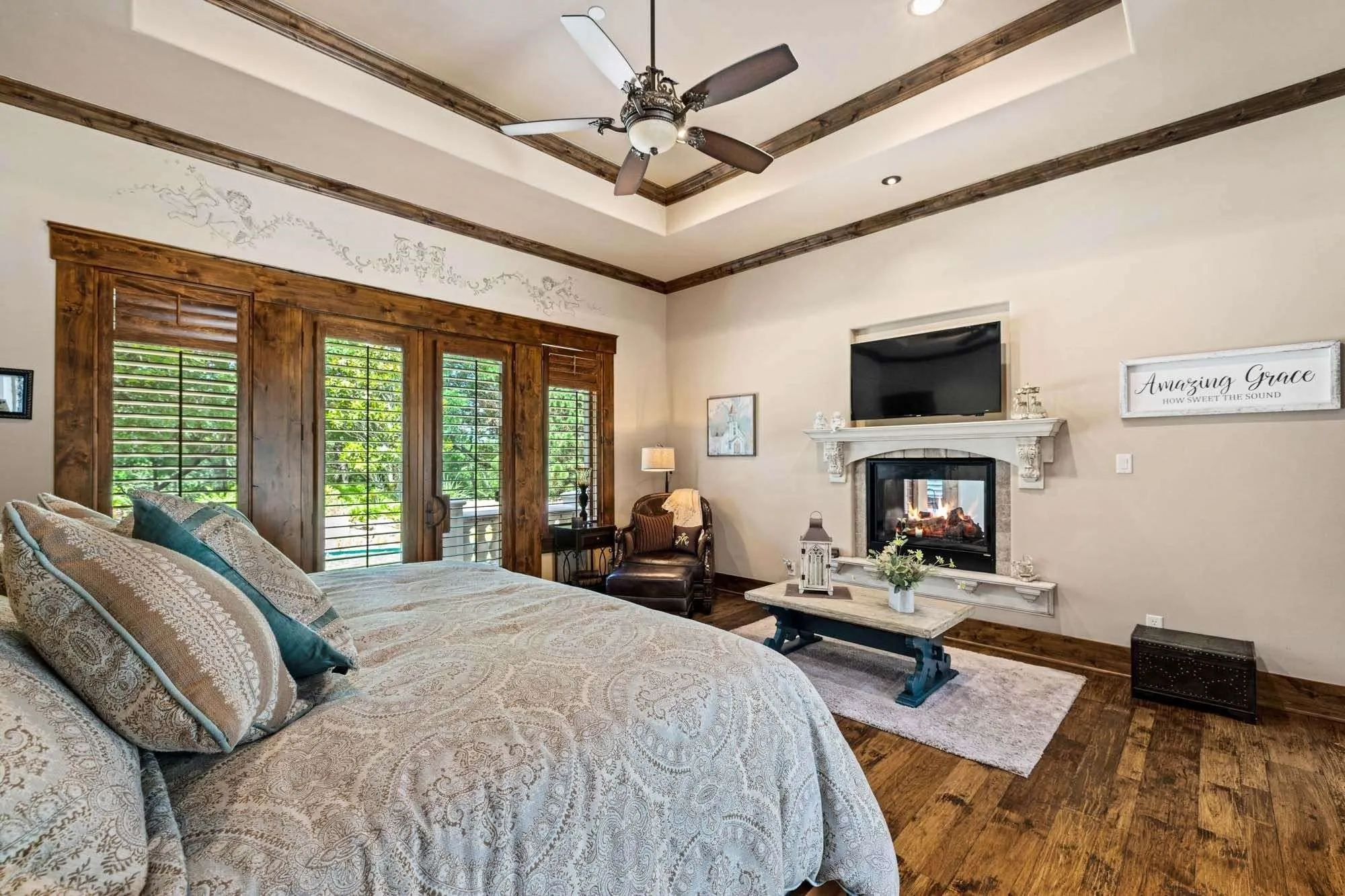 Primary bedroom with fireplace on first floor