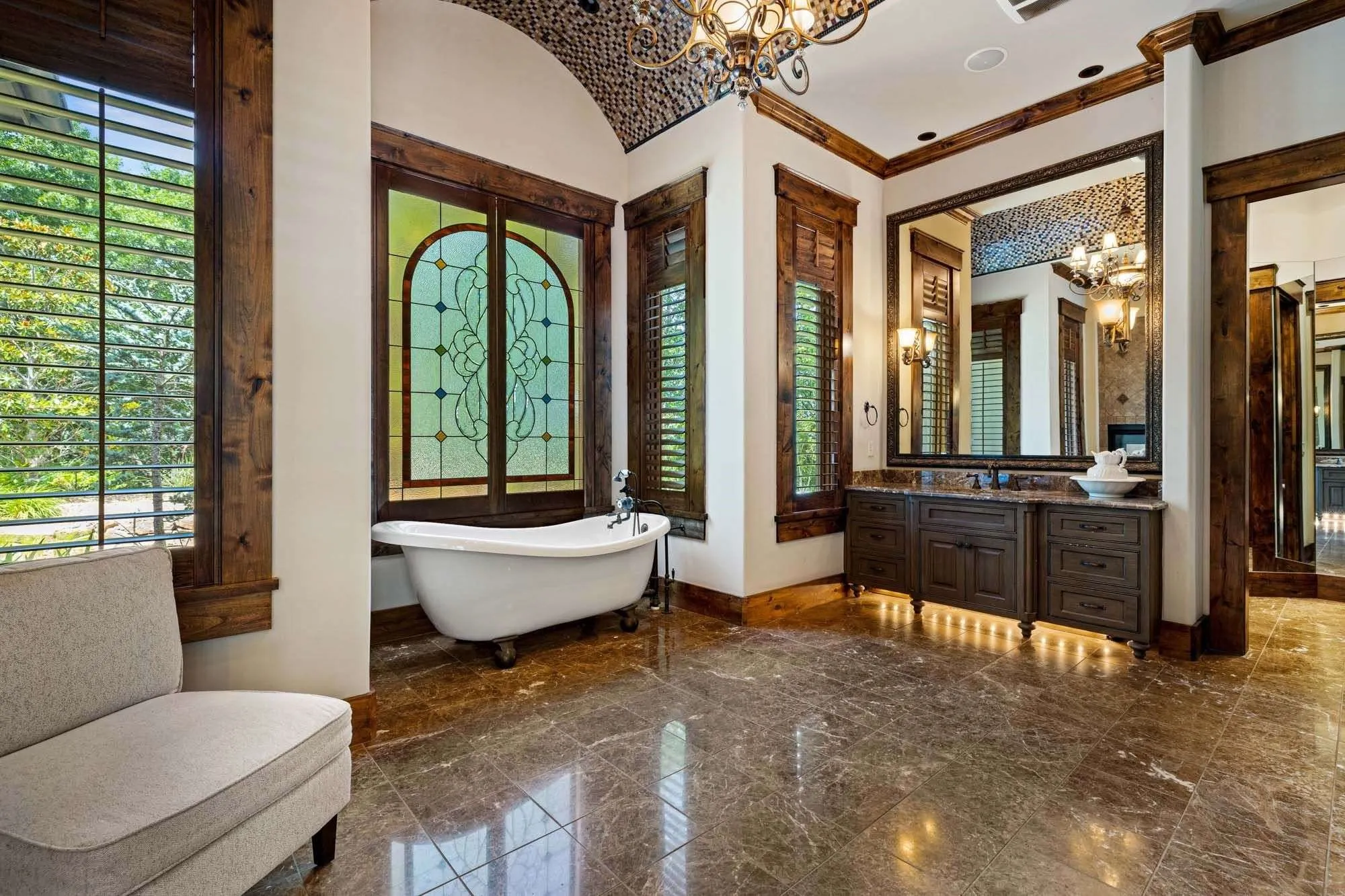 Soak tub, dual vanities, and incredible views of the surrounding trees