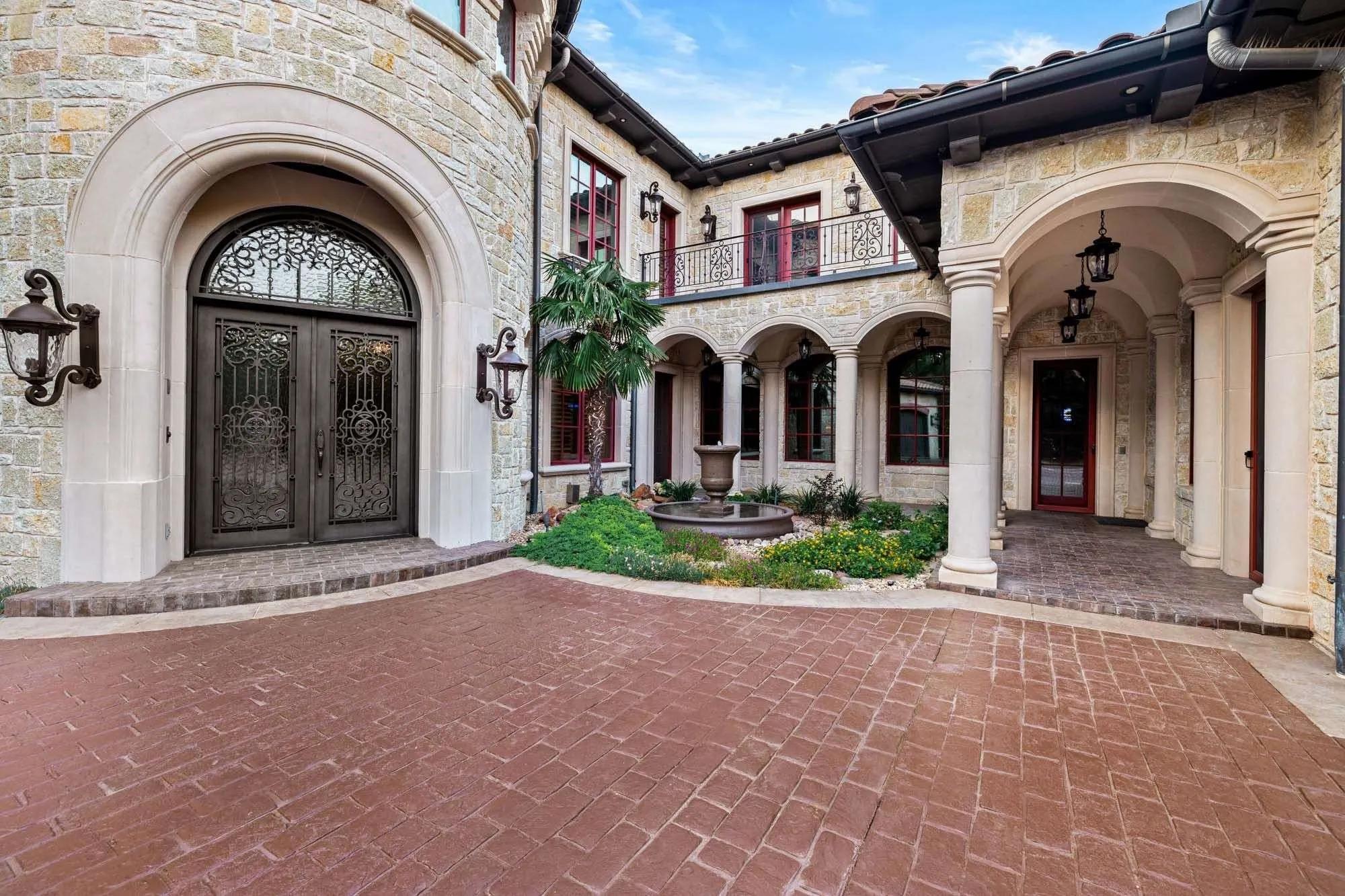 Mediterranean home with stone elevation built on piers
