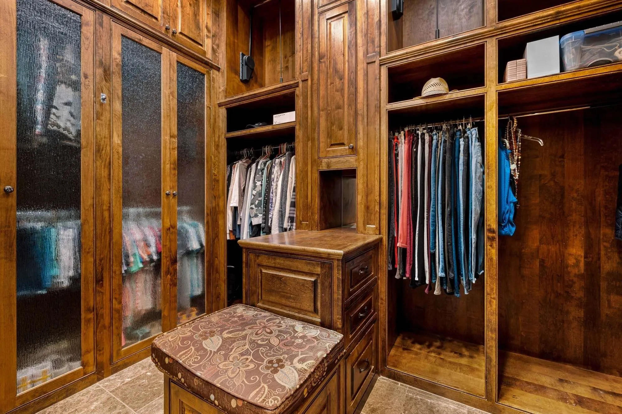 Two sided custom closet in primary bedroom
