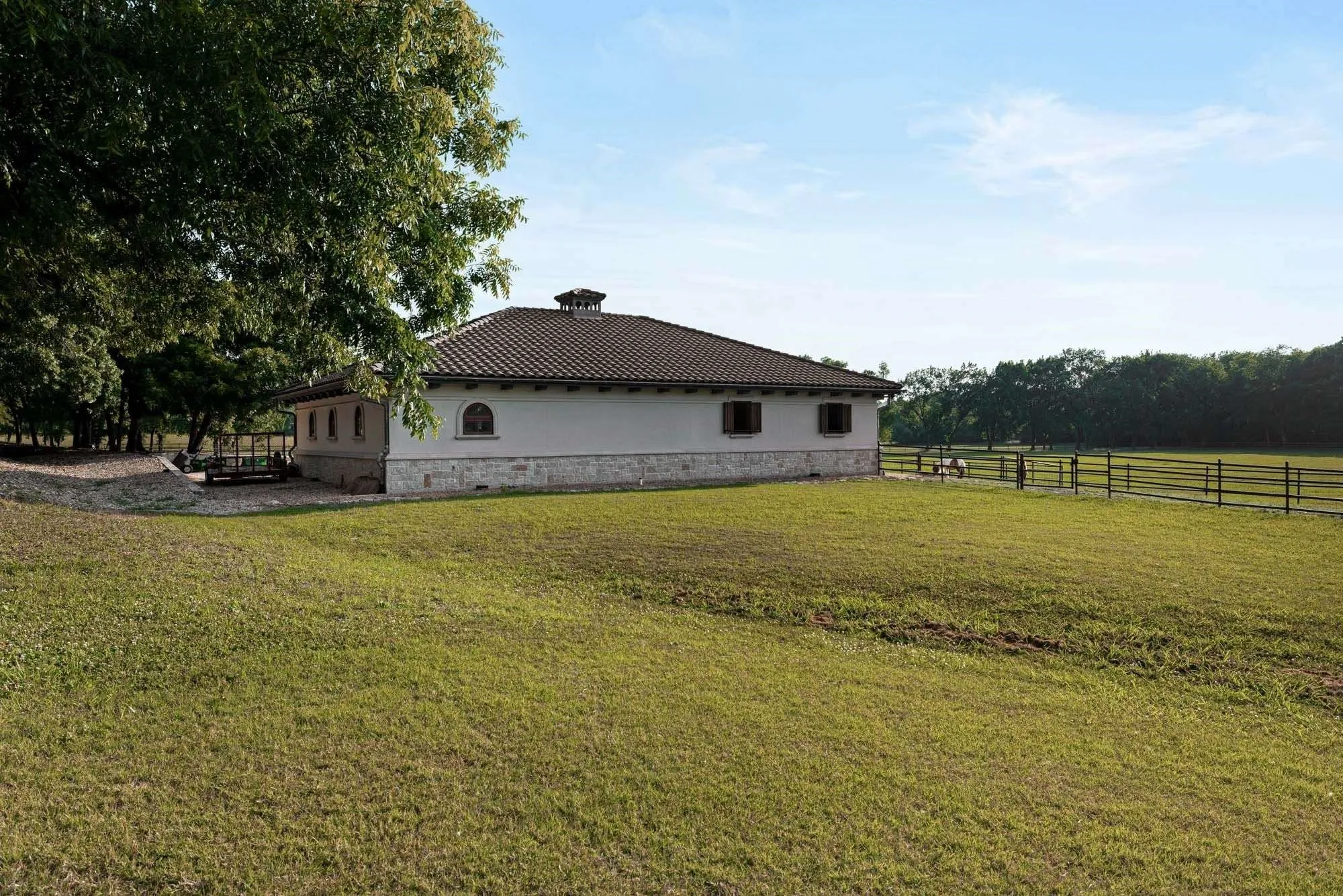 Separate driveway leads to 4 stall barn and pasture area