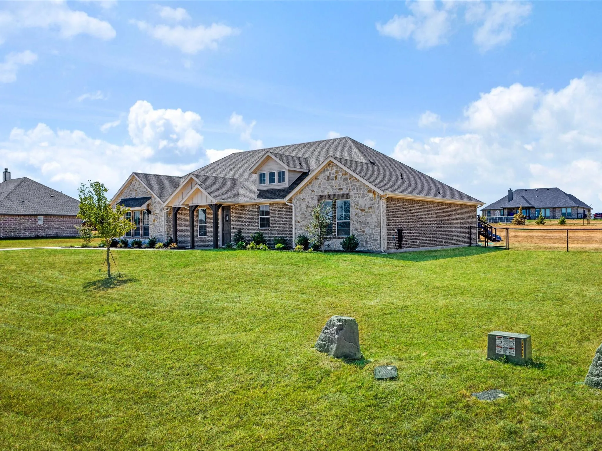 Stone and brick exterior with multiple gables