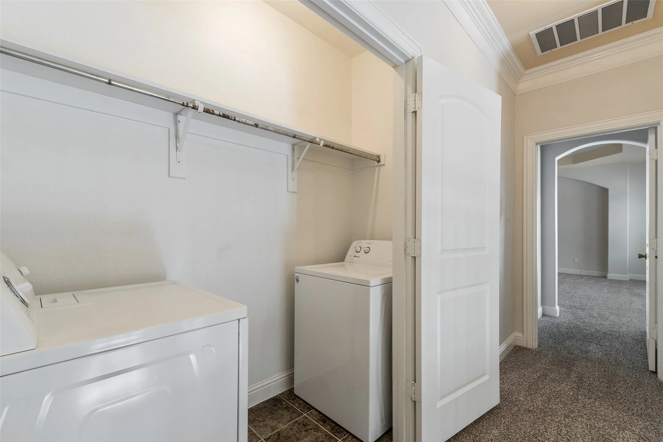 Functional utility closet with tile flooring