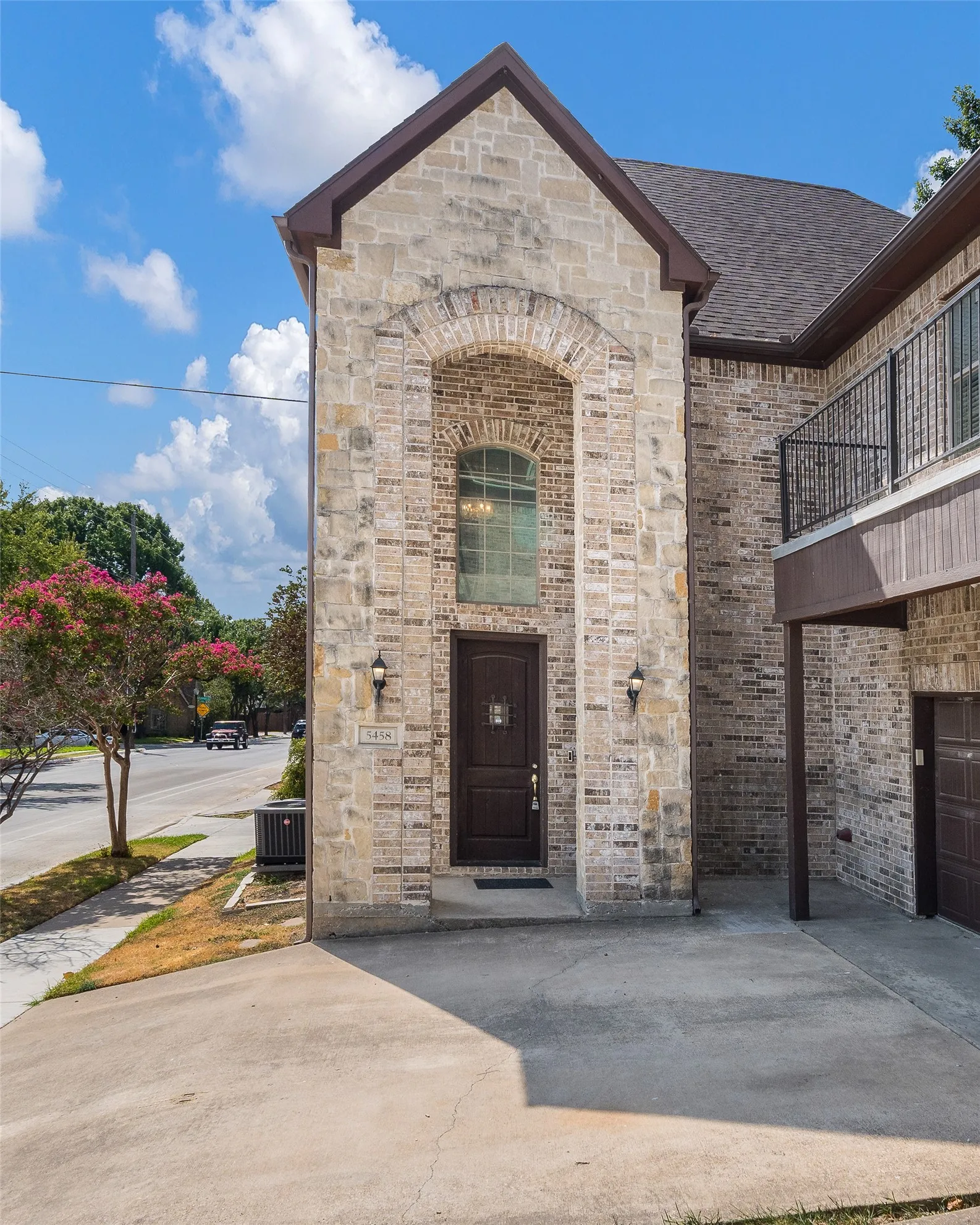 Stone and brick exterior with arched window detail