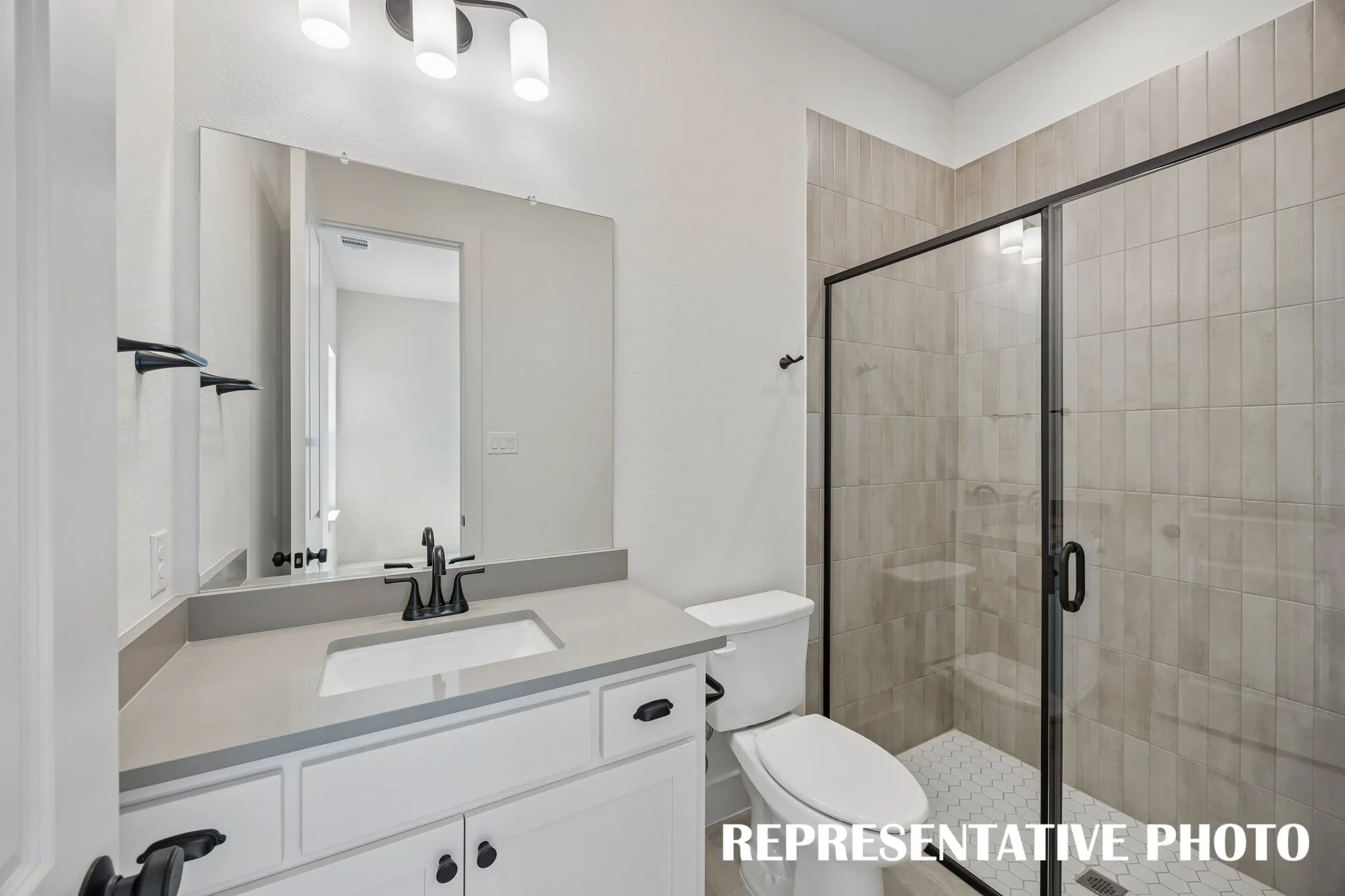 Friends and family will feel right at home in any of the beautifully finished guest baths our Kimball plan has to offer.  REPRESENTATIVE PHOTO