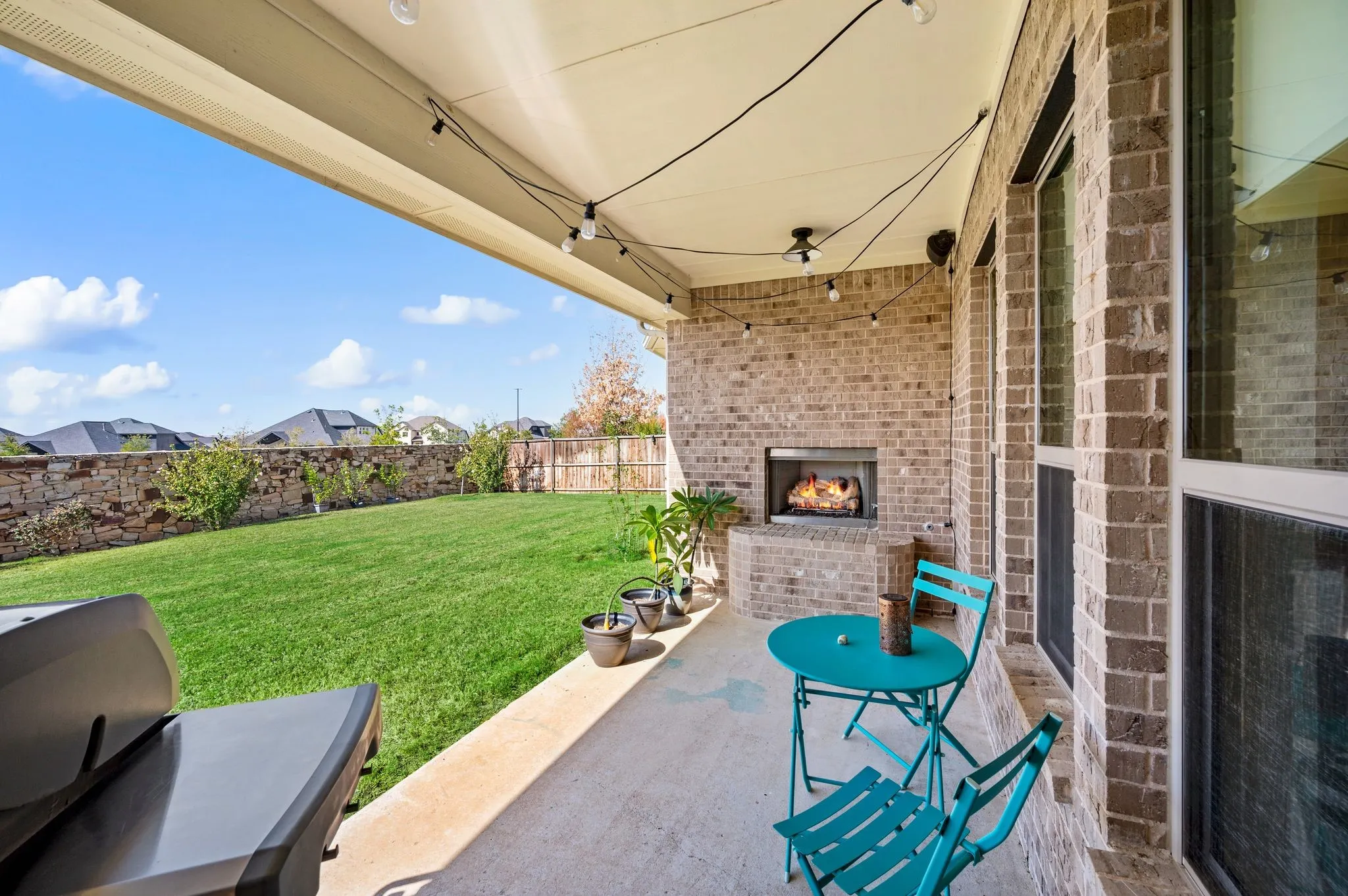 Wonderful outdoor space with gas log fireplace.