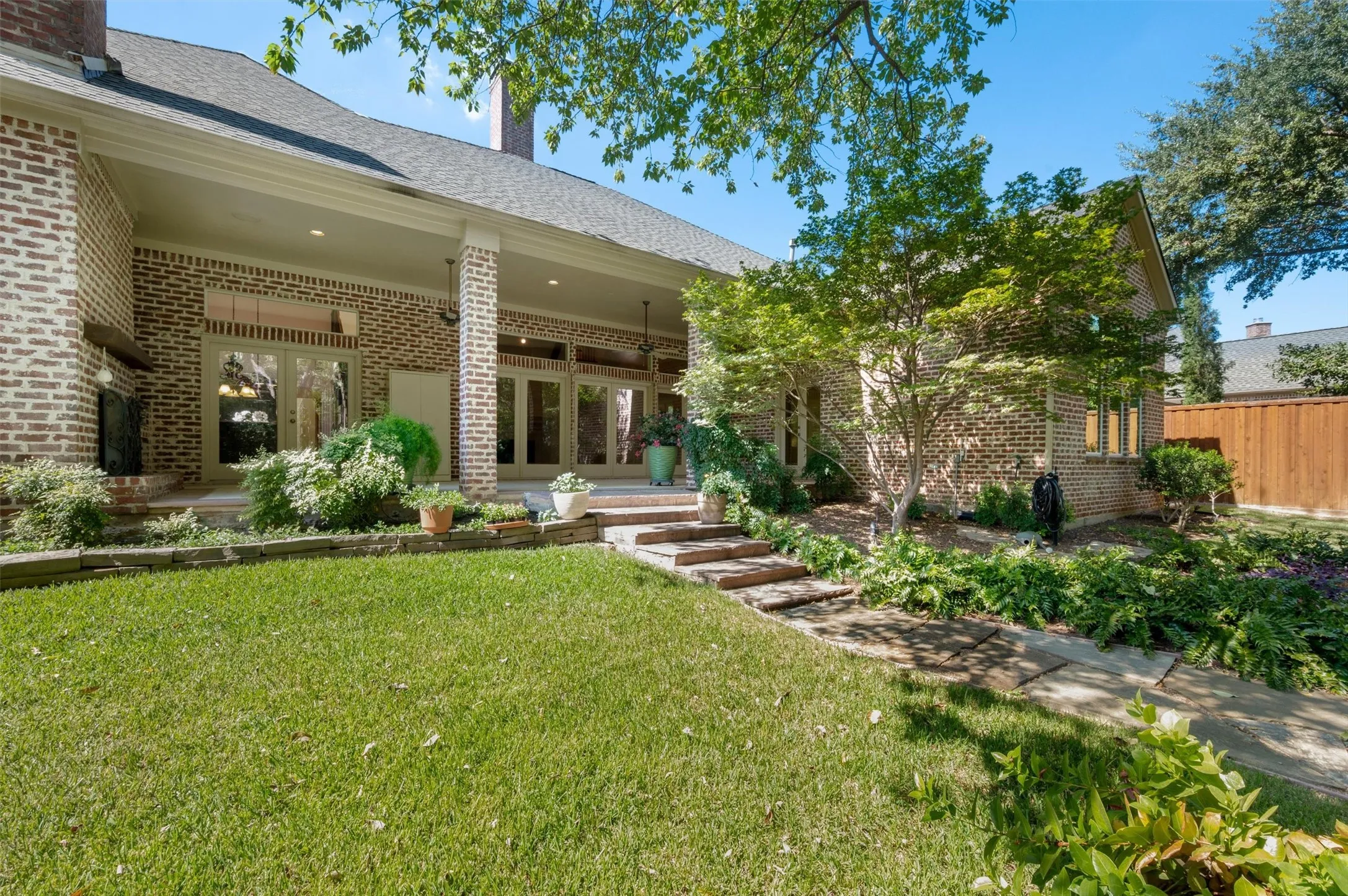 Beautiful back of house and gentle slop to the back of the property with the serene creek.