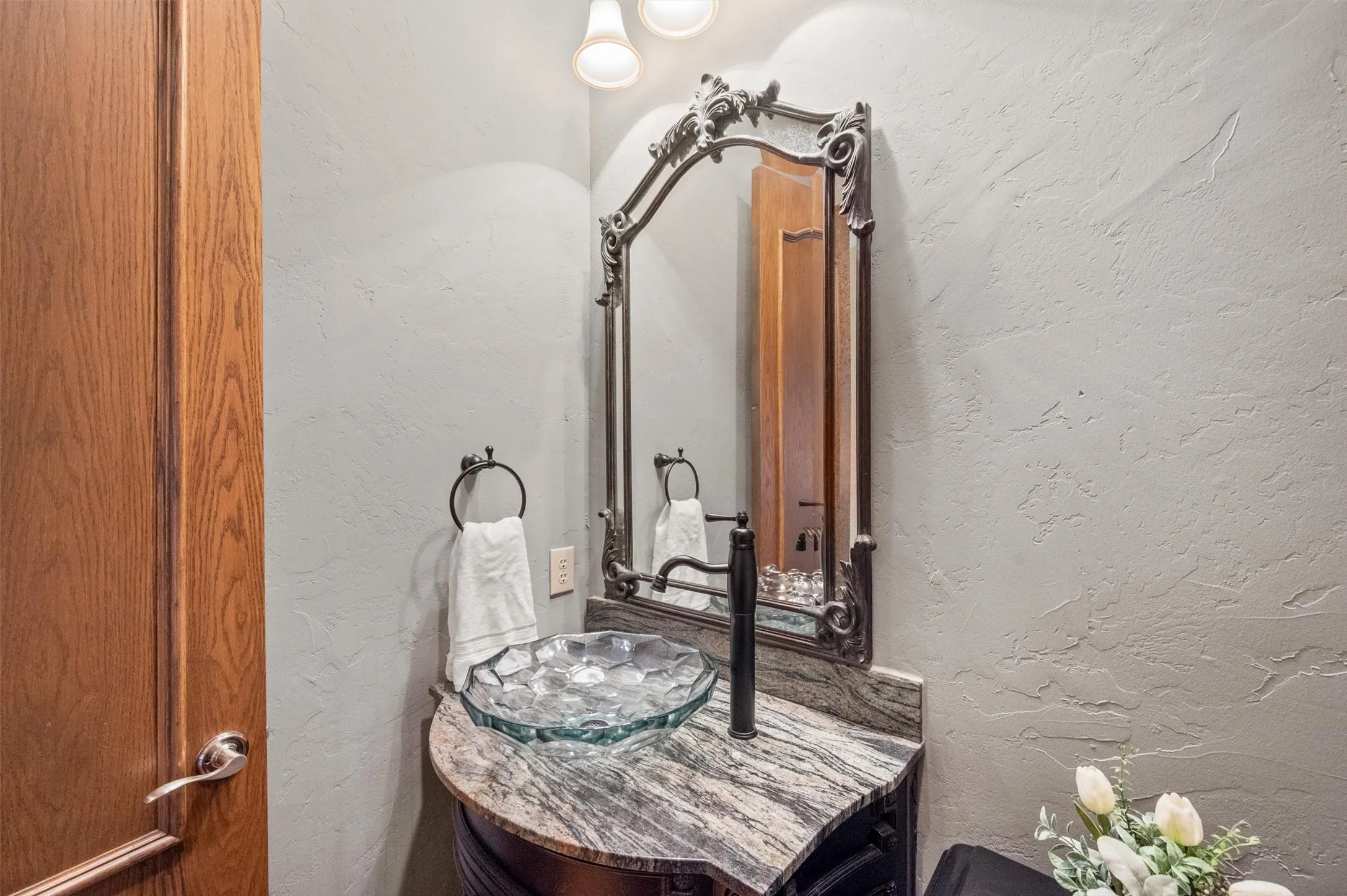 Downstairs half bath conveniently located near living, dining, library.