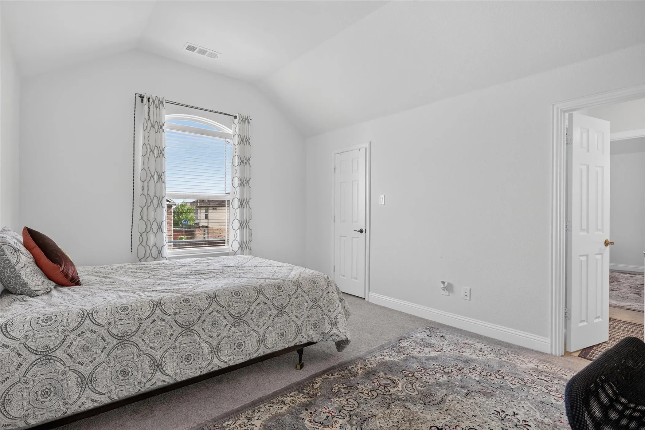 Vaulted ceiling with an arched window