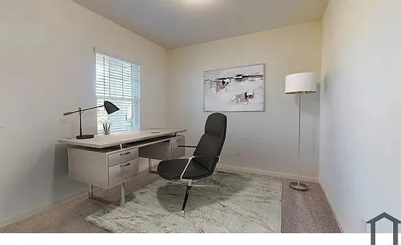 Window with horizontal blinds and light-toned walls