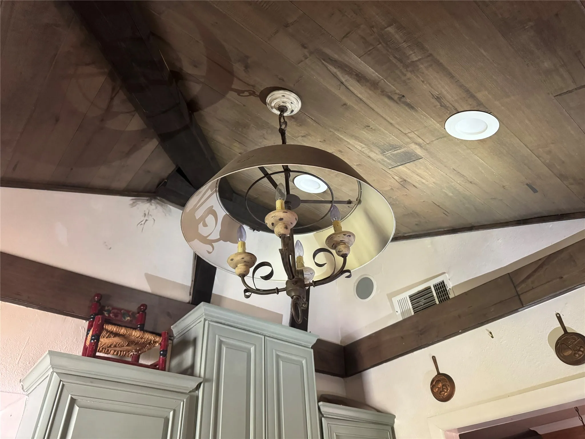 Wood-paneled ceiling with exposed wood beams