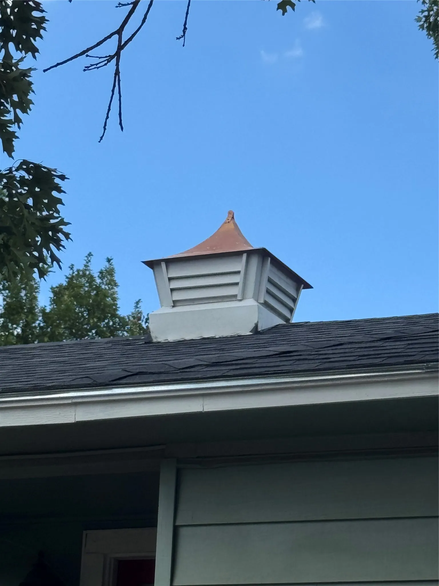Architectural cupola with a copper-tone roof accent