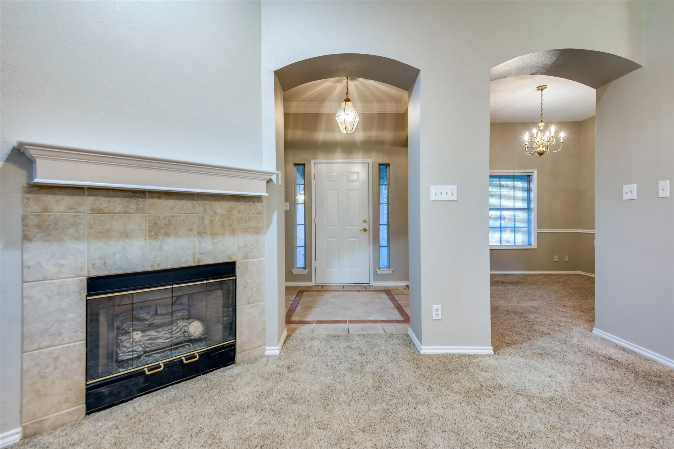 Fireplace with a tile surround and mantel