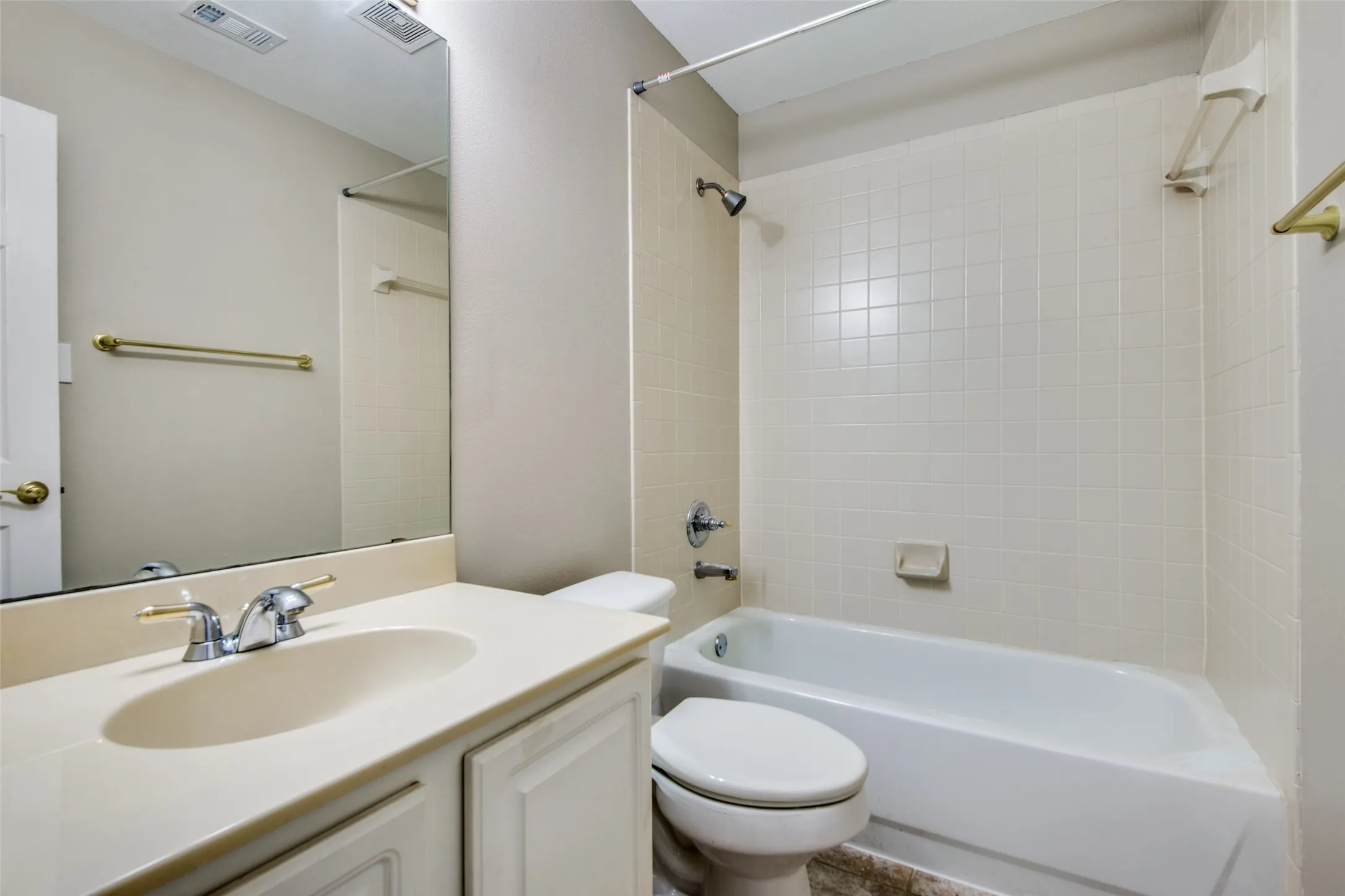 Integrated vanity with an oval sink and chrome faucet
