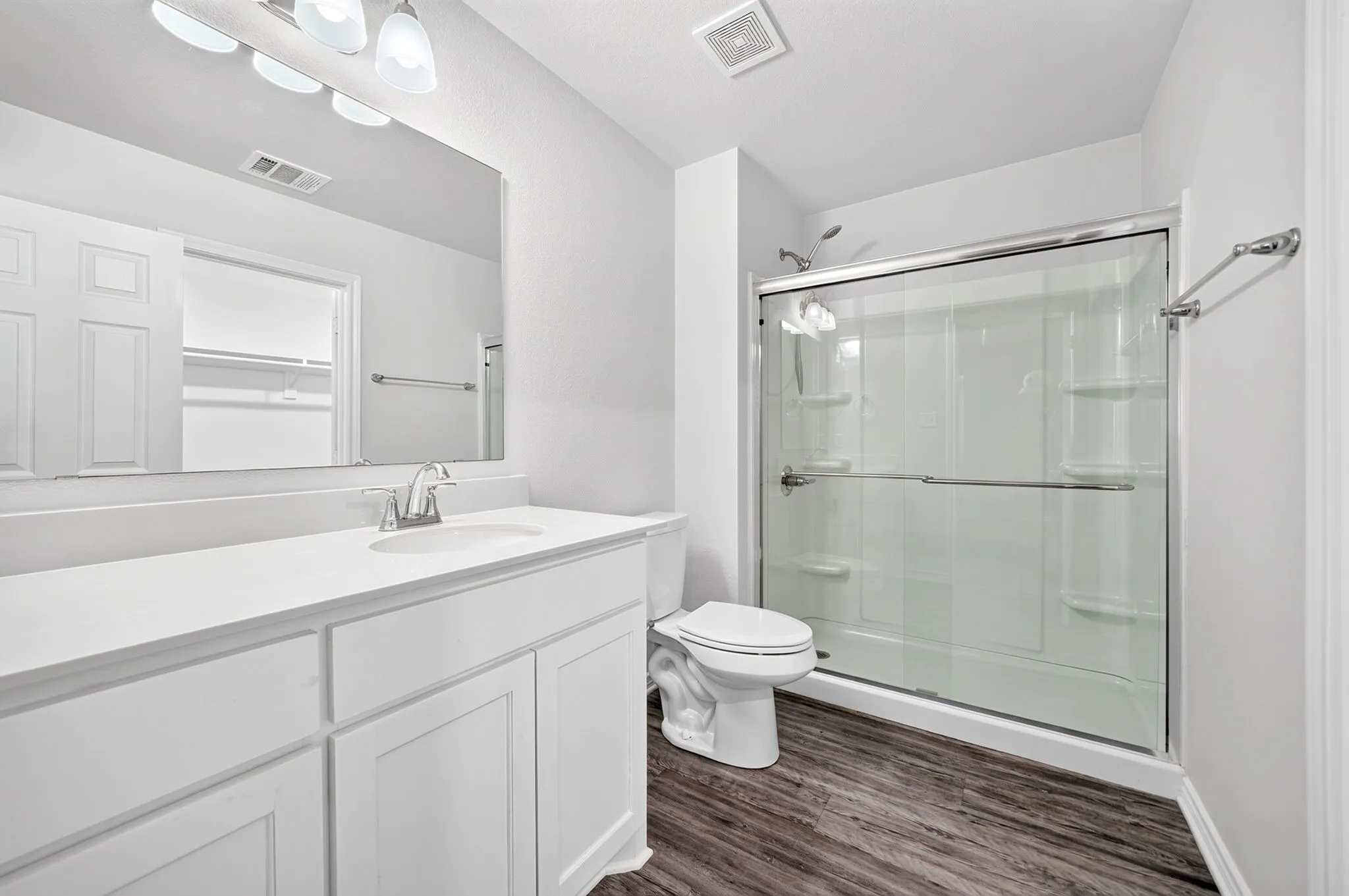 Vanity with a single sink, an integrated countertop, and storage cabinetry