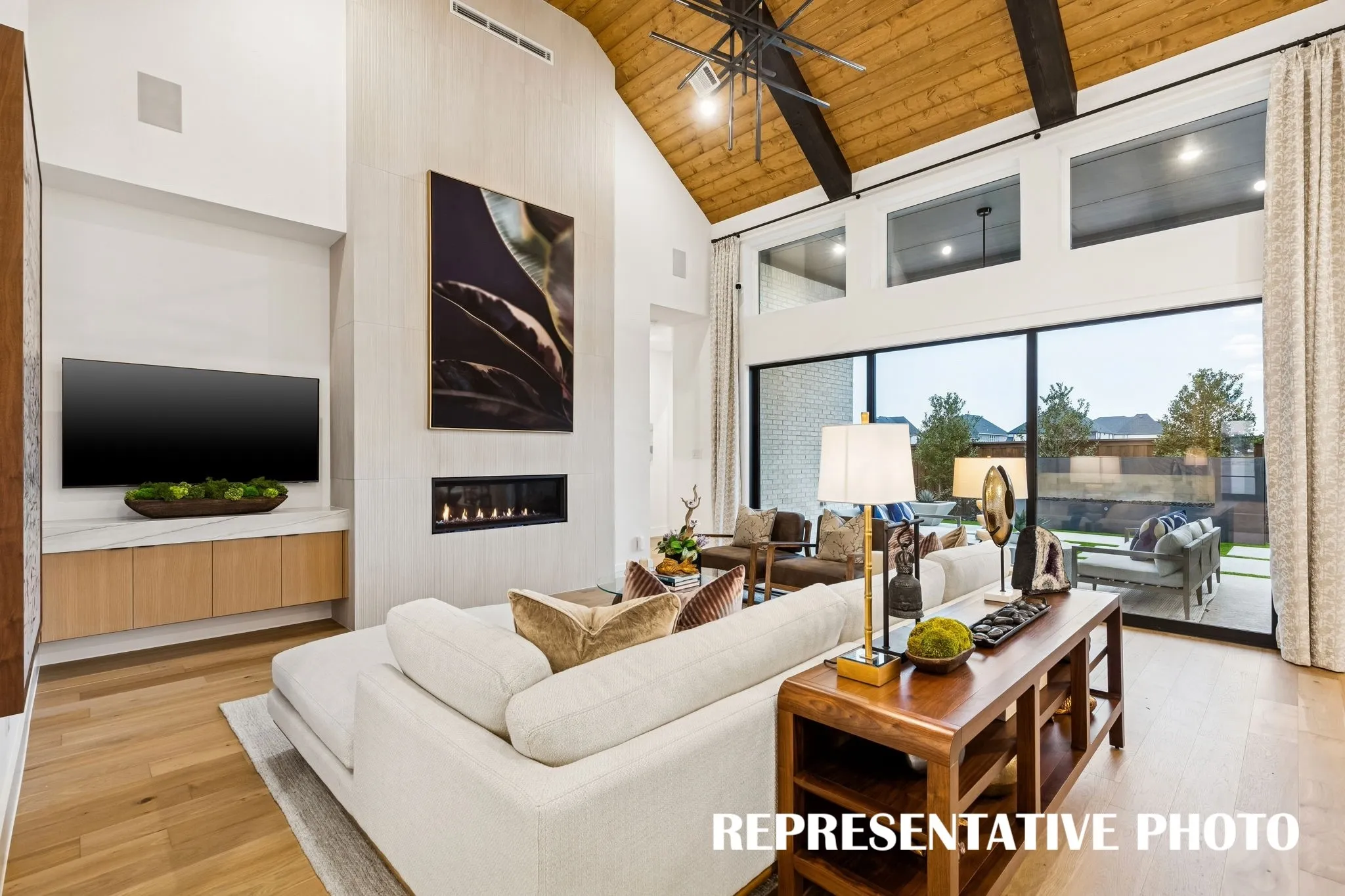 Featuring a full wall slider, it's easy to take the party outdoors in this dream home!  REPRESENTATIVE PHOTO