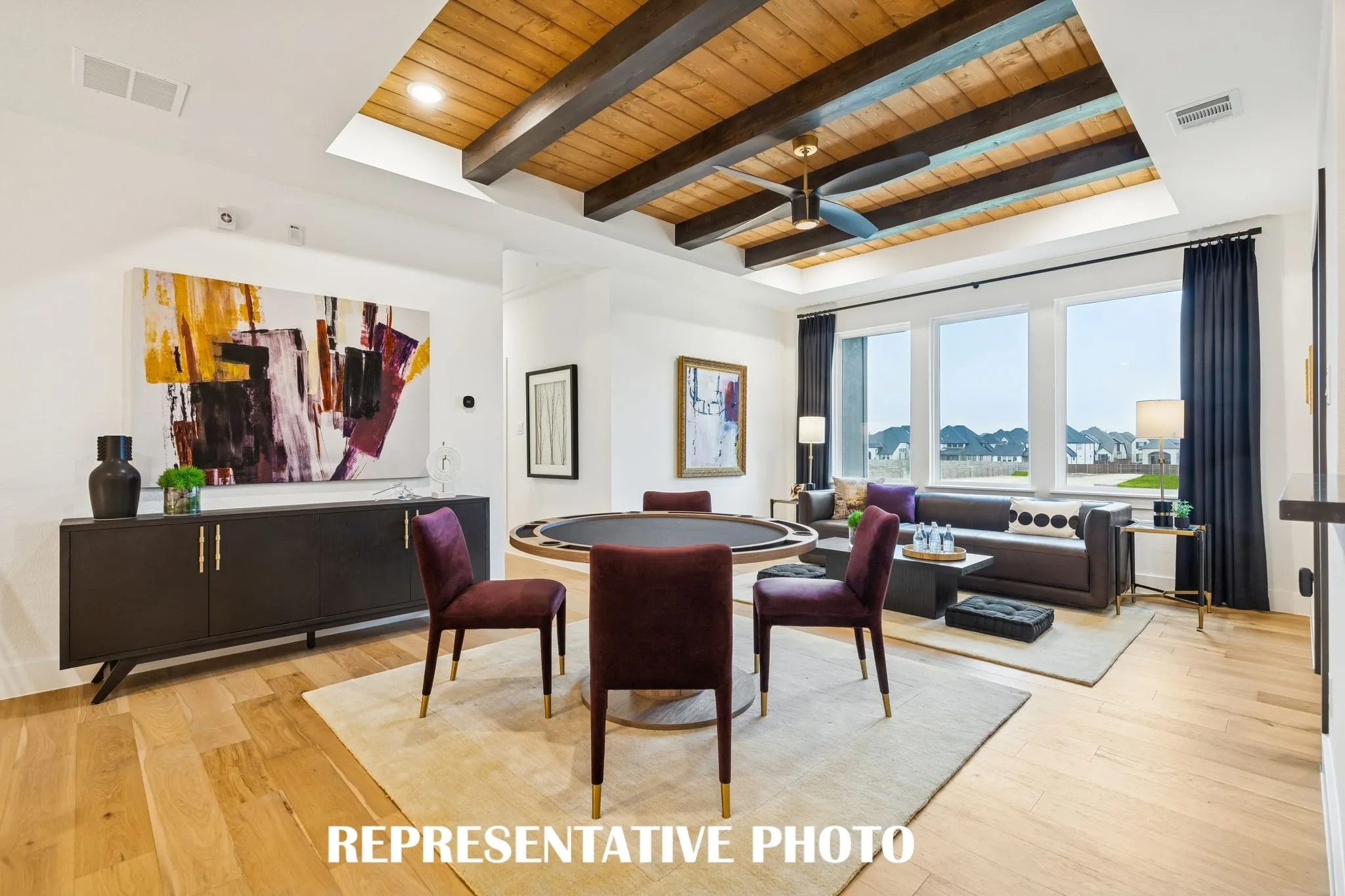 Light, bright and inviting, this wonderful game room offers an outstanding space for family fun time!  REPRESENTATIVE PHOTO