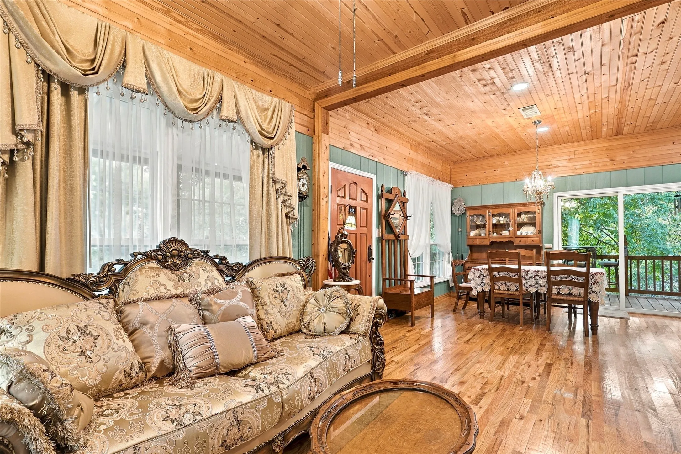 Wood-finish flooring throughout, featuring a natural wood plank ceiling and walls