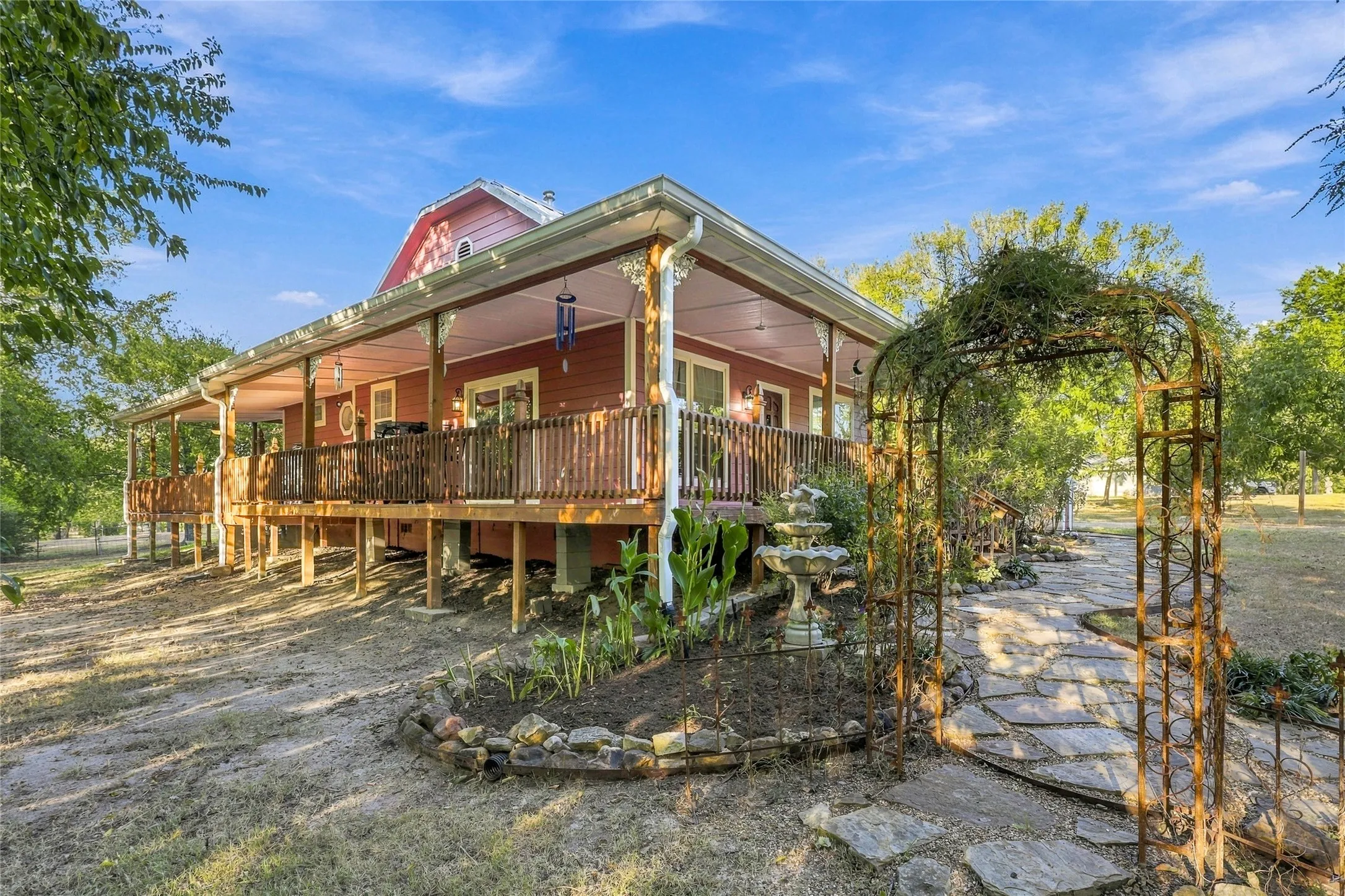 Expansive covered porch with wood railings