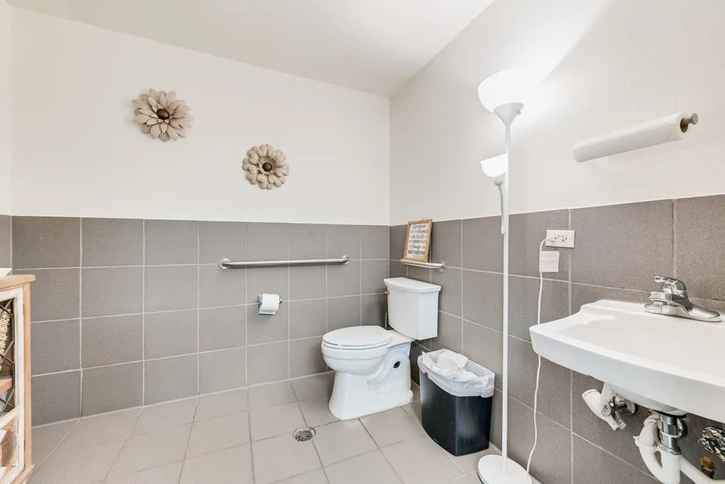 Wall-mounted sink with chrome faucet
