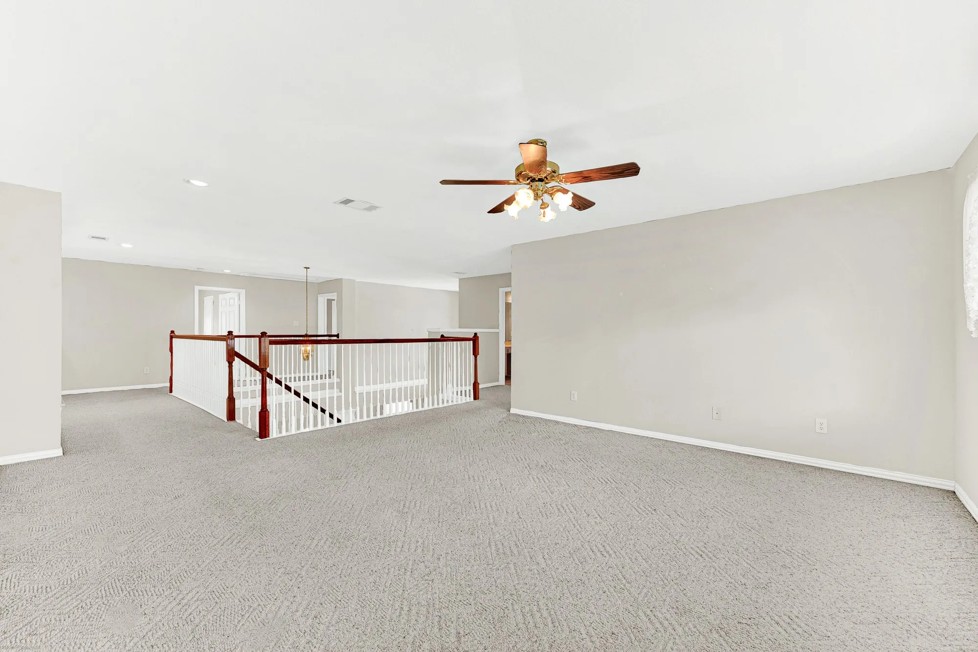 An open banister overlook keeps the second-floor flex space connected to the foyer below. Enjoy seamless traffic flow and an airy overhead feel throughout the upper level.
