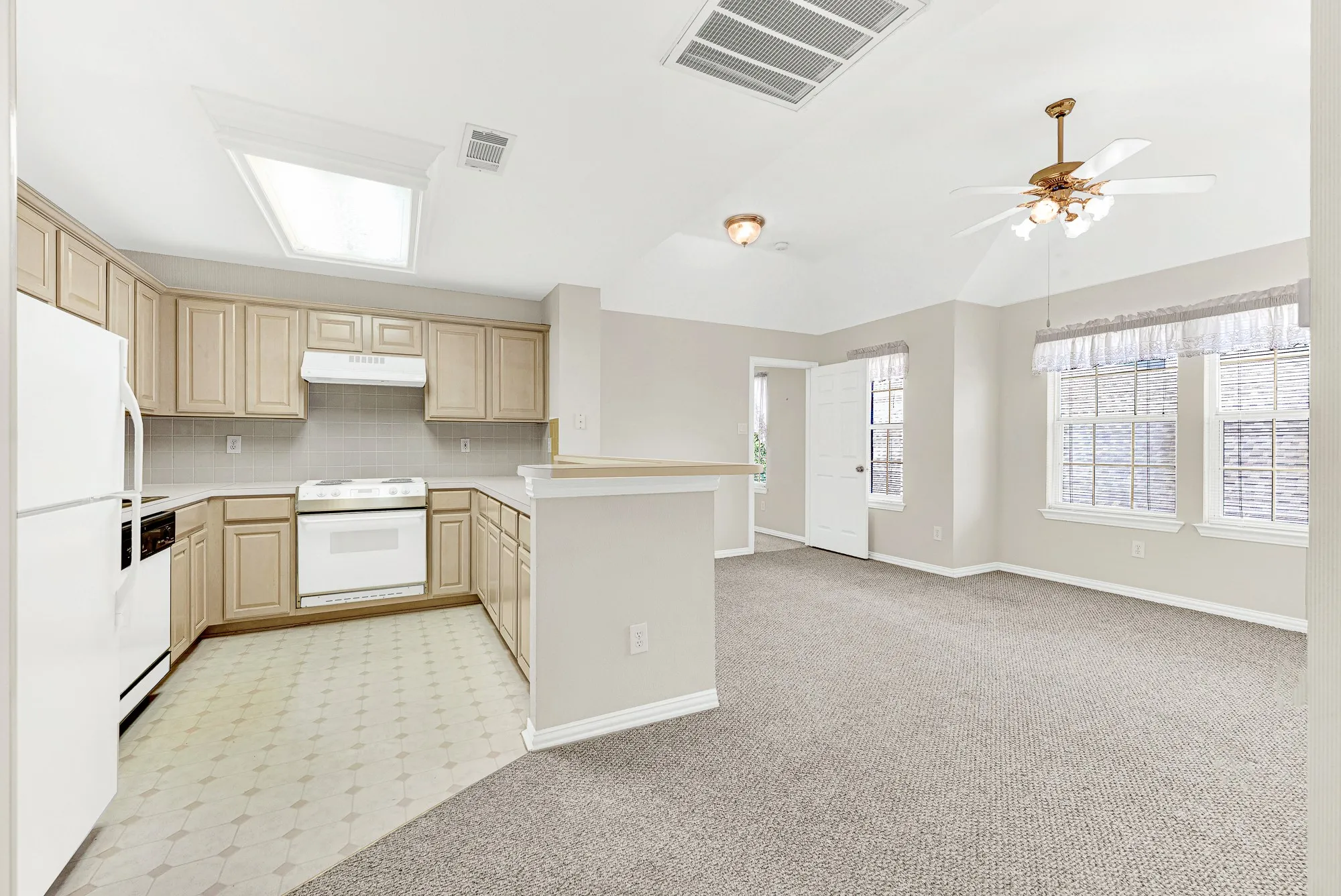 A raised breakfast counter overlooks the bright sitting room with multi-window views. Host a casual morning visit over coffee without ever leaving the complete in-law suite of the game room.